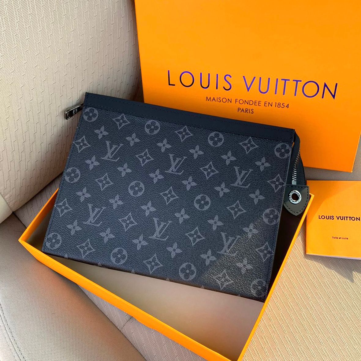 Louis Vuitton Pochette Voyage MM clutch bag in Monogram Eclipse canvas. image 1