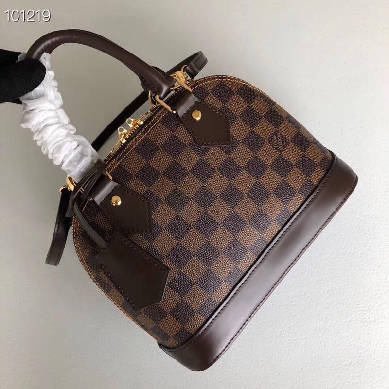 Louis Vuitton Alma BB bag in Damier Eb?ne coated canvas with smooth cowhide-leather trim and gold-color hardware. image 1