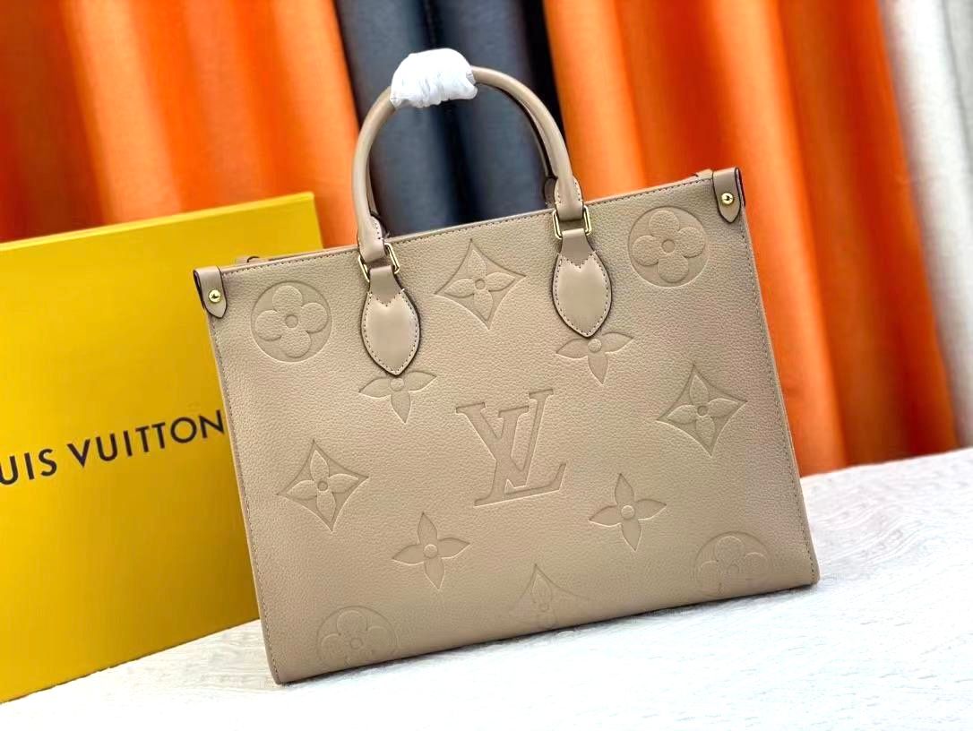 Louis Vuitton OnTheGo MM tote bag in Tourterelle Monogram Empreinte embossed leather. image 1