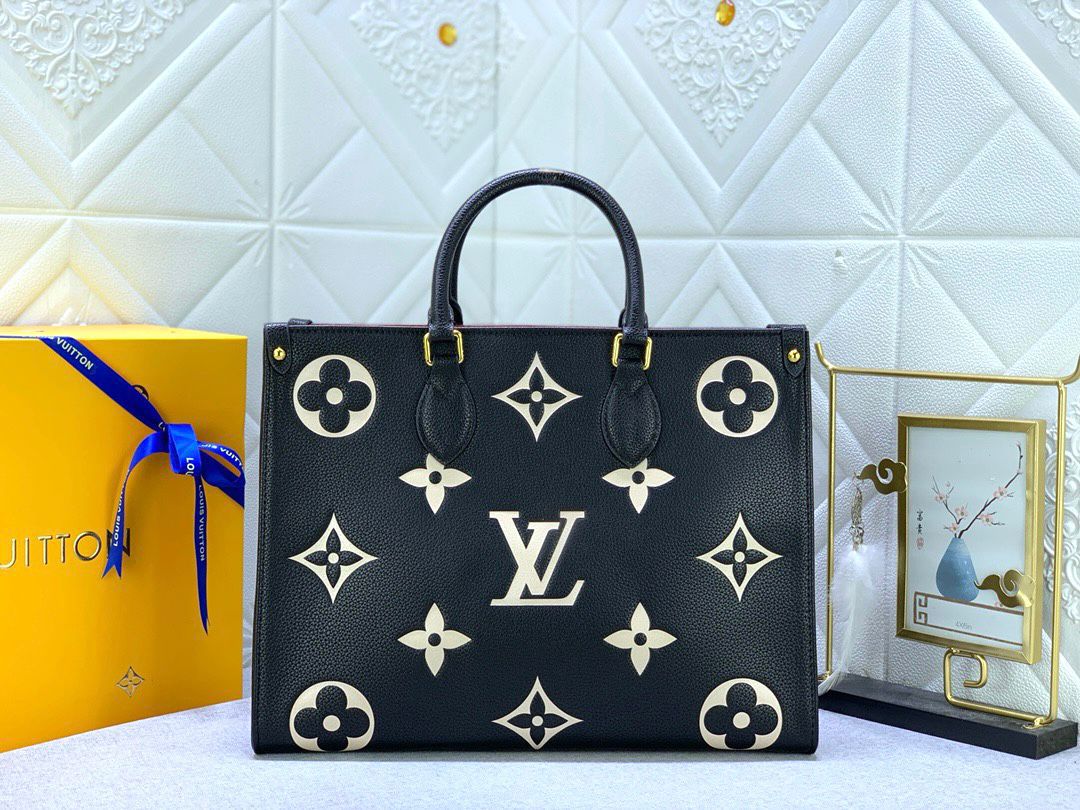 Louis Vuitton OnTheGo MM tote bag made from bicolor black and beige Monogram Empreinte leather. image 1