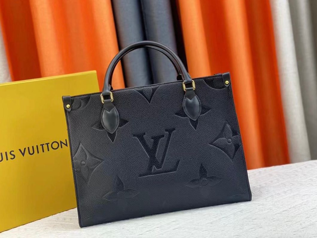 Louis Vuitton OnTheGo MM tote bag in black Monogram Empreinte embossed leather. image 1