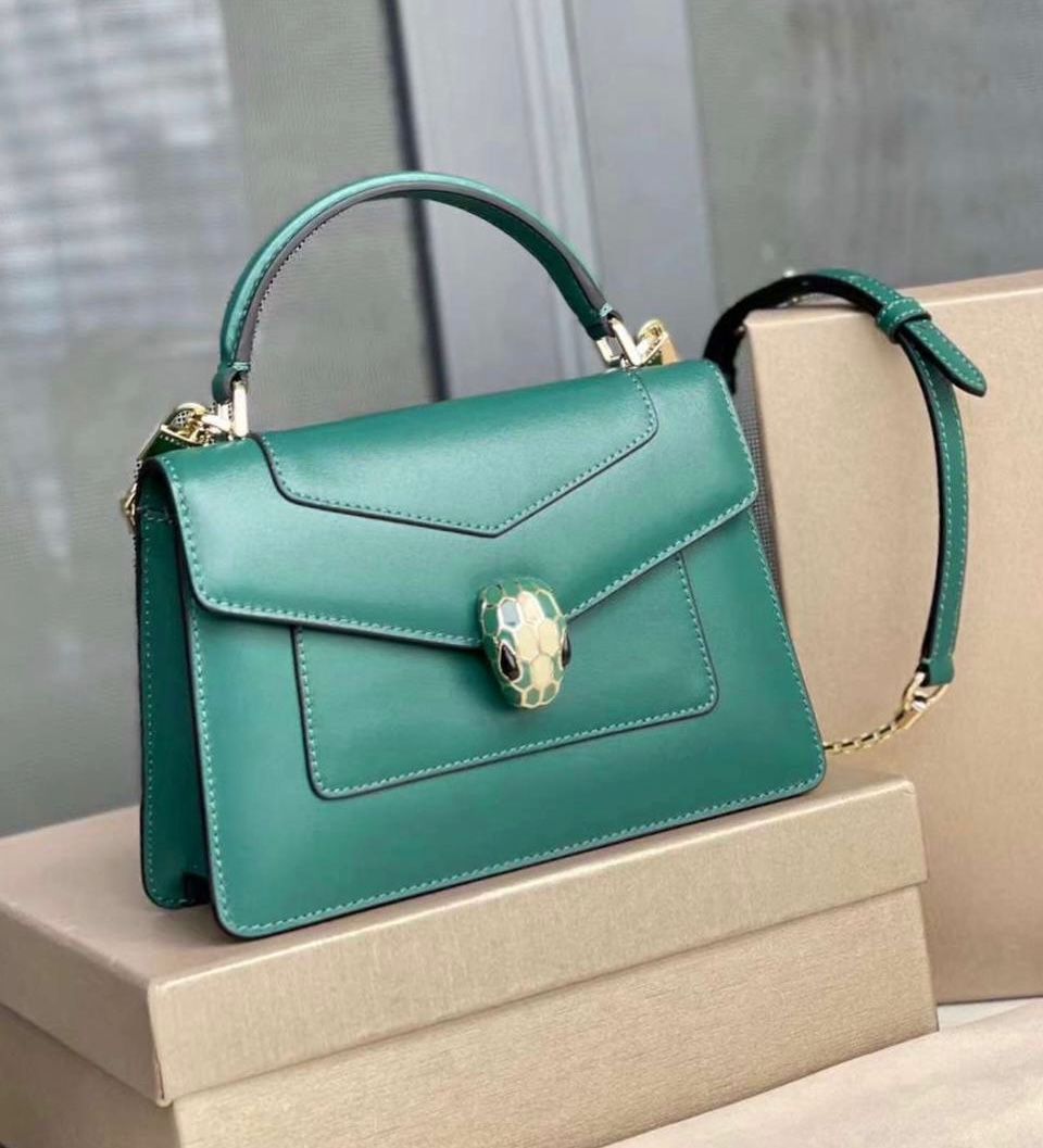 Bulgari Serpenti Forever top handle bag in emerald green calf leather with a light gold-plated brass snakehead closure. image 1
