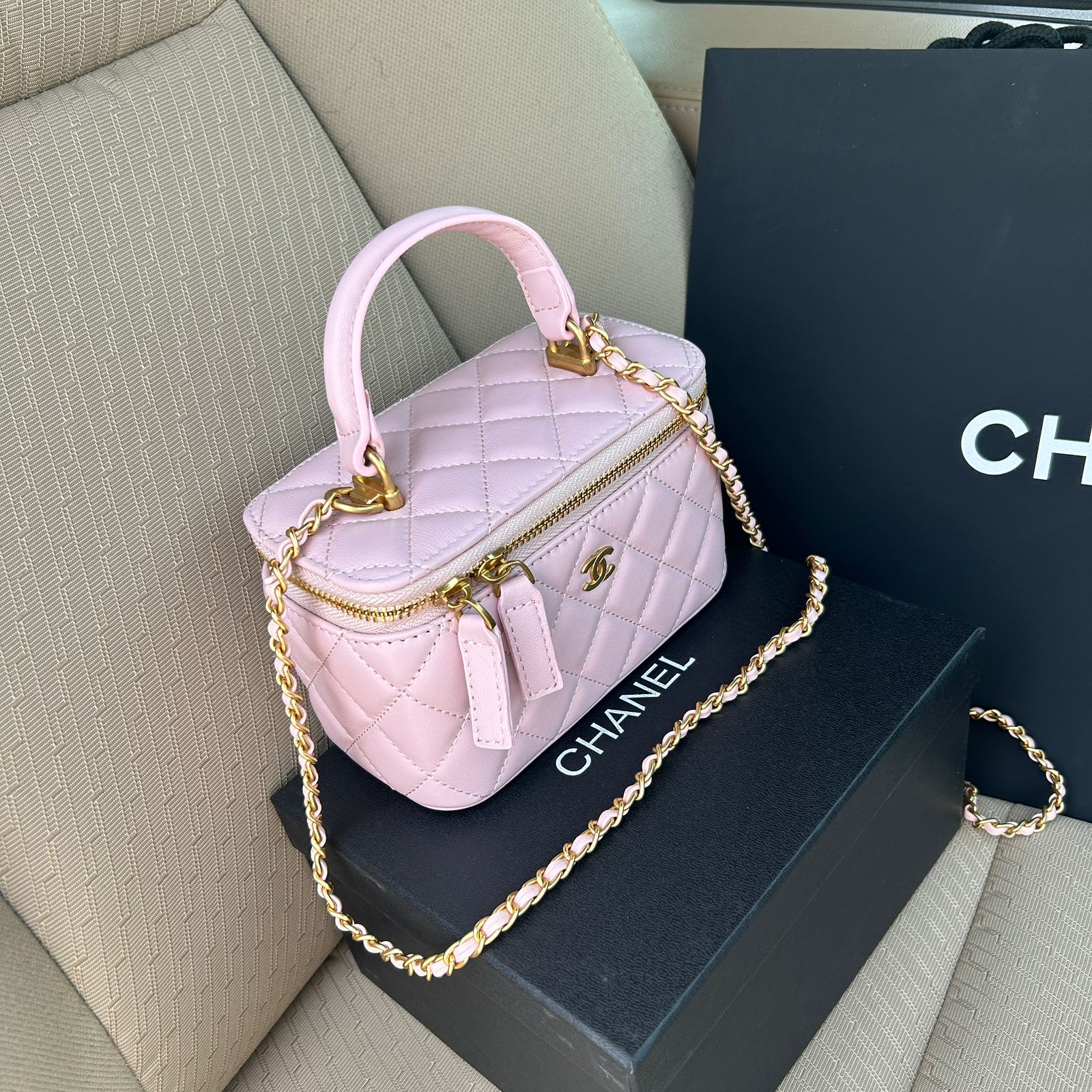 Chanel Small Top Handle Vanity Case in pink quilted lambskin with gold-tone hardware. image 1