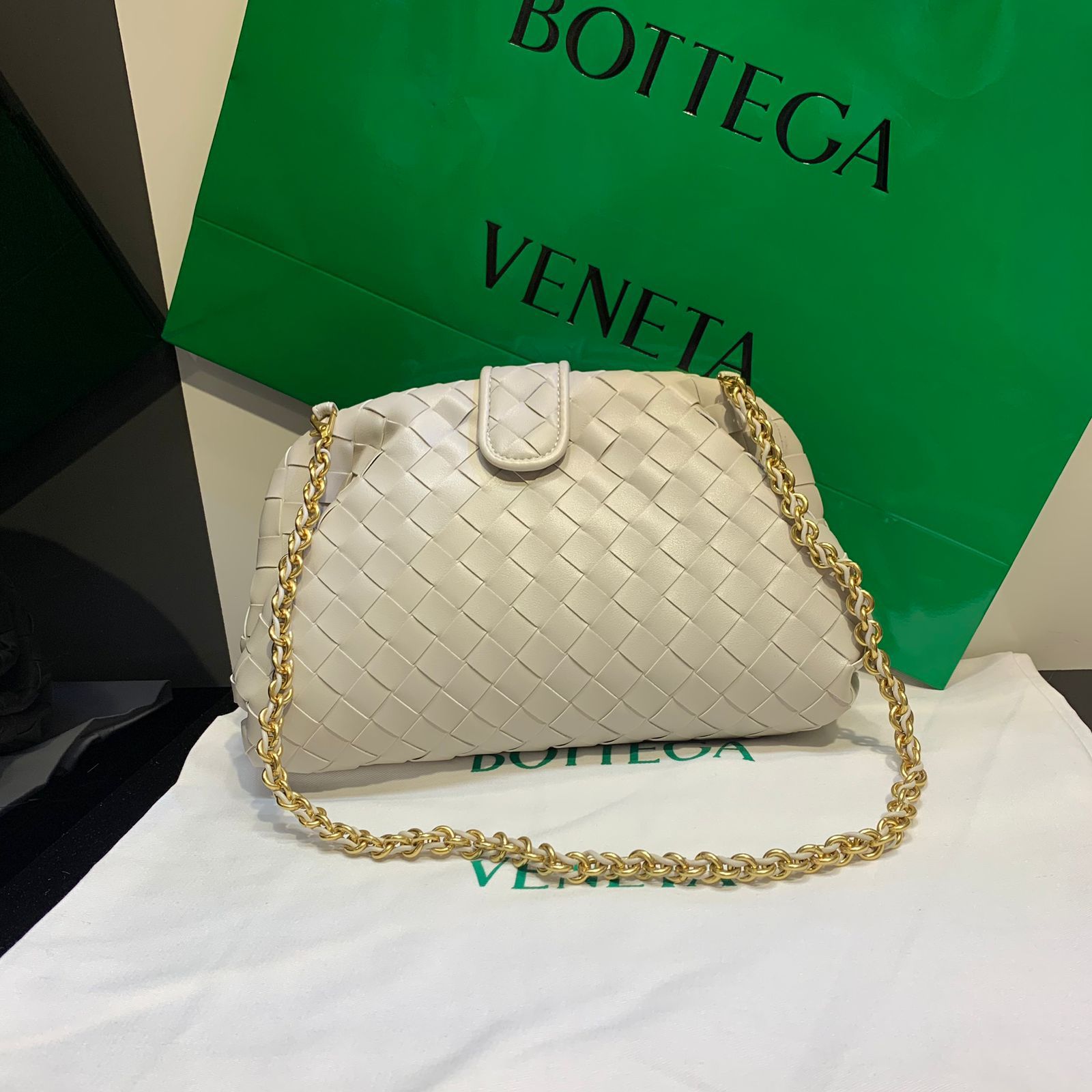 Bottega Veneta Small Lauren 1980 clutch bag in chalk white intrecciato leather with a gold-tone chain strap. image 1