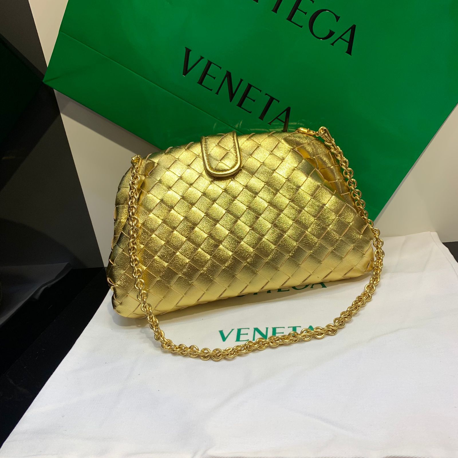 Bottega Veneta Small Lauren 1980 clutch in metallic gold intrecciato leather. image 1
