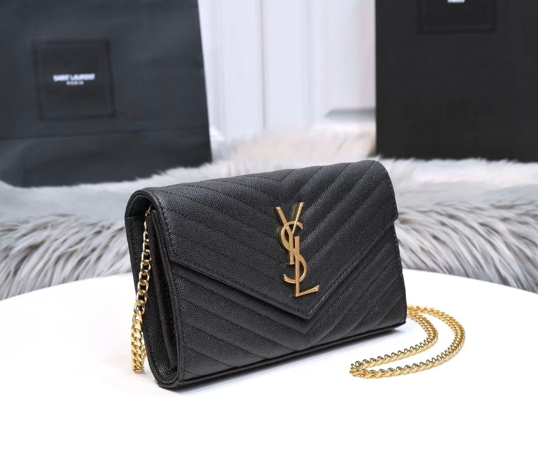Saint Laurent Cassandre Matelass? envelope chain wallet in black grain de poudre embossed leather with a gold-tone metal monogram logo and chain strap. image 1