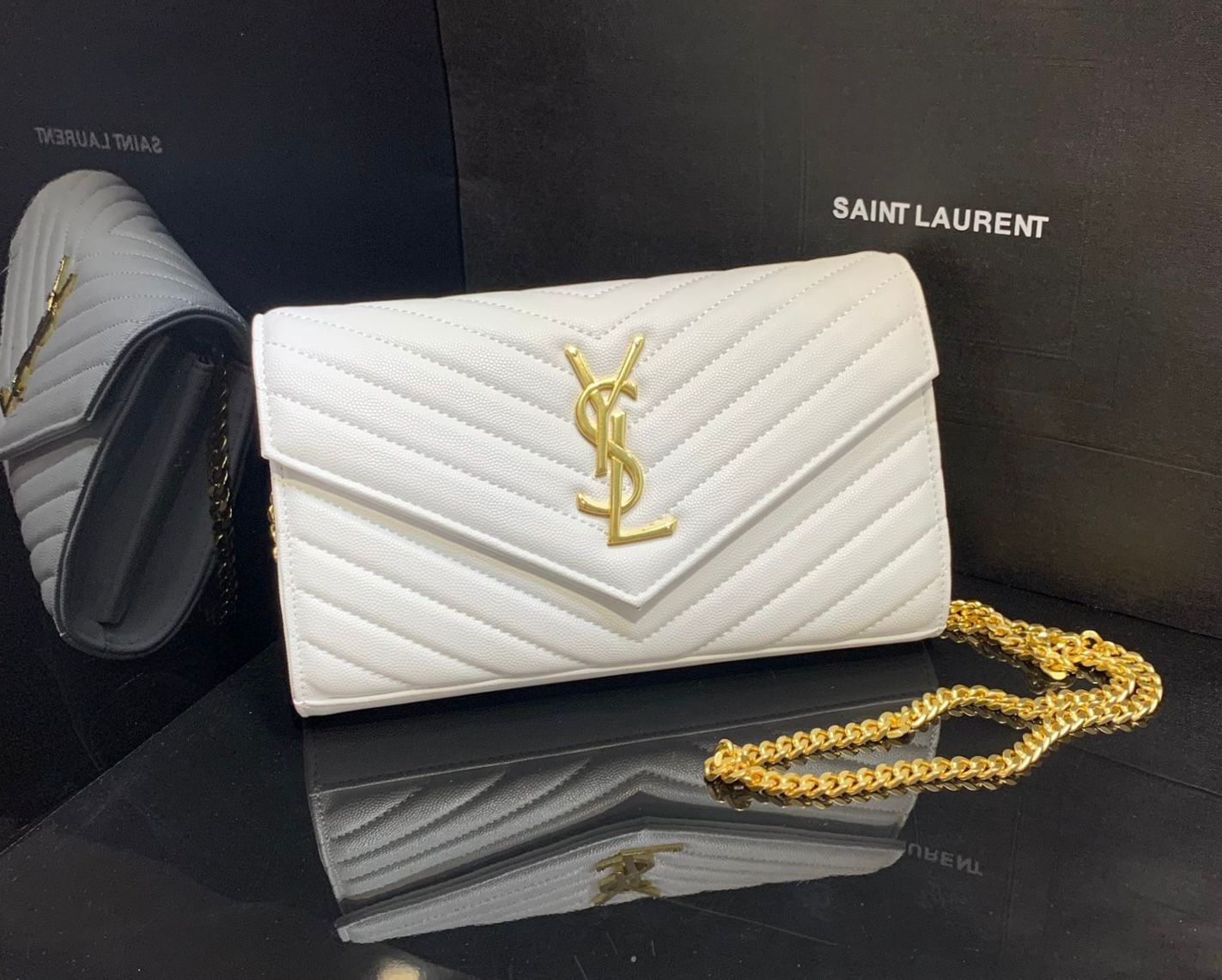 Saint Laurent Monogram Envelope Chain Wallet in white grain de poudre embossed leather. image 1