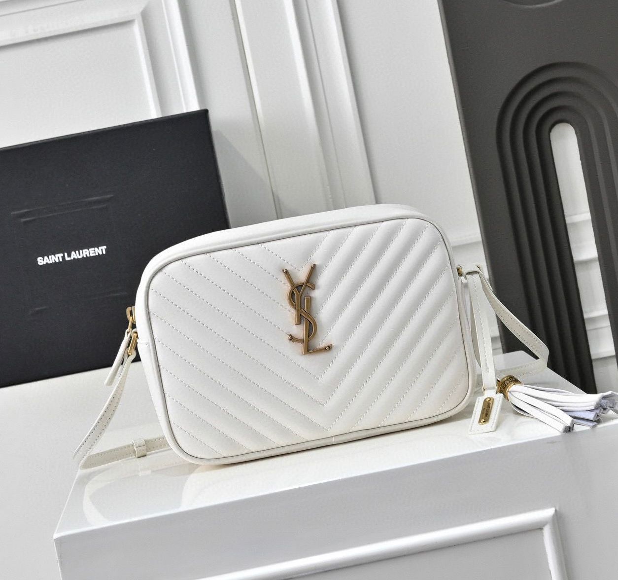 Saint Laurent Lou Camera Bag in white or "crema soft" quilted leather with gold-tone hardware. image 1