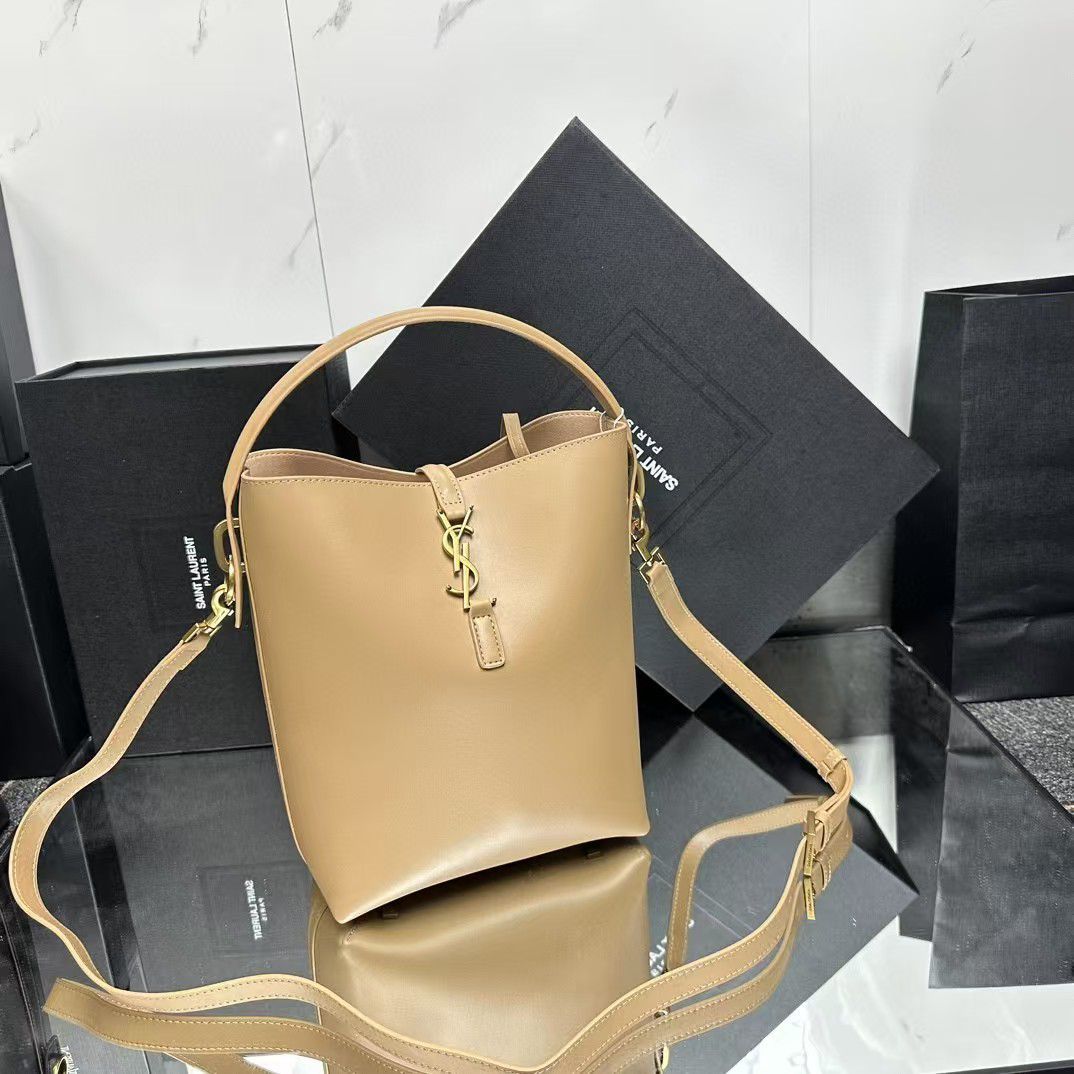 Saint Laurent Le 37 small bucket bag in beige calf leather with a signature YSL logo plaque and gold-tone hardware. image 1