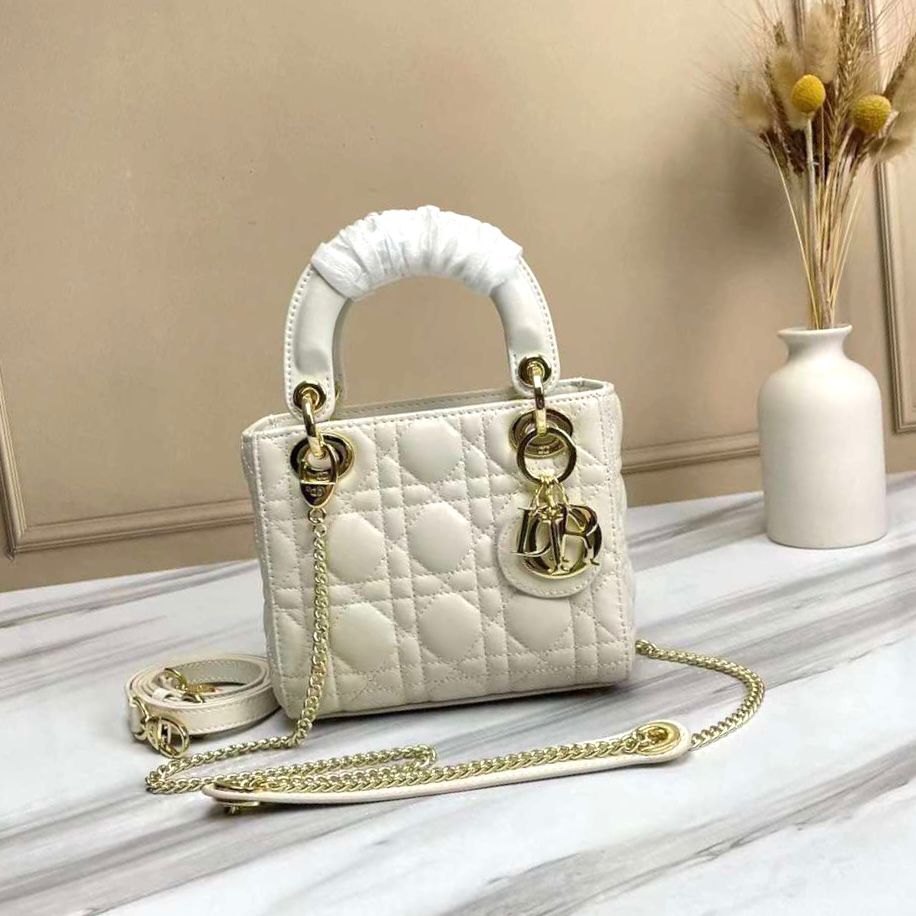 Dior bag in latte or off-white cannage lambskin with pale gold-finish metal D.I.O.R. charms. image 1