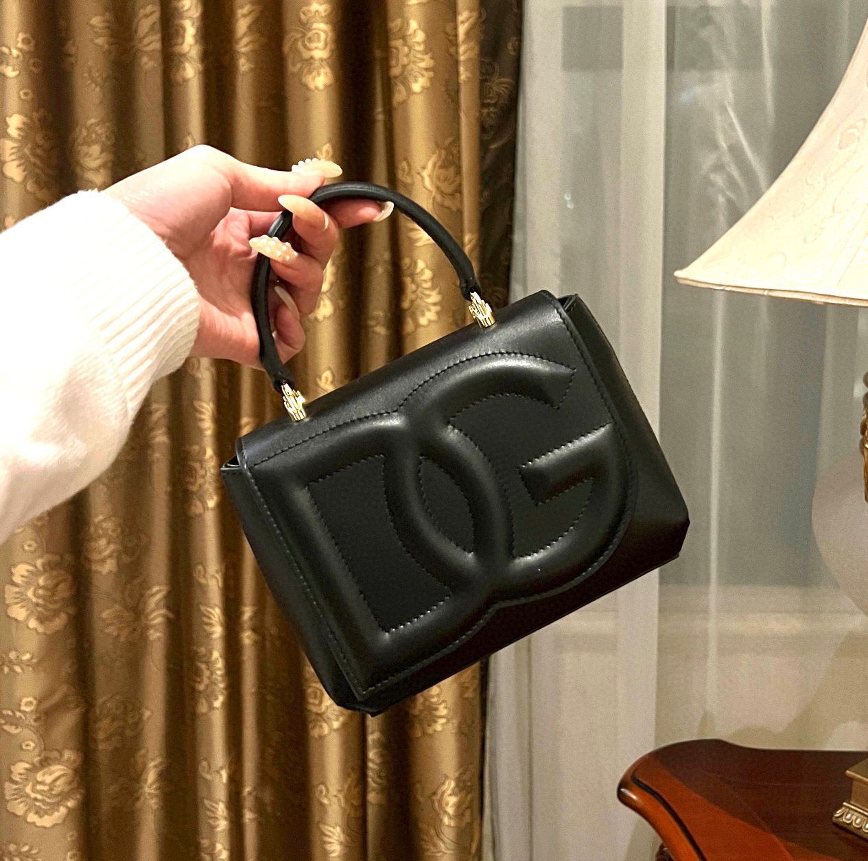 Dolce & Gabbana DG Logo Top Handle Bag in black leather. image 1