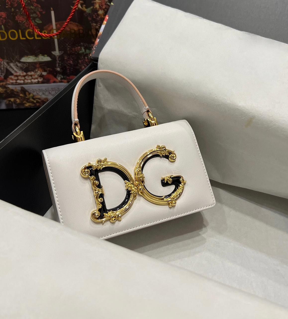 Dolce & Gabbana DG Girls top handle bag in white nappa leather with a gold-tone baroque DG logo. image 1
