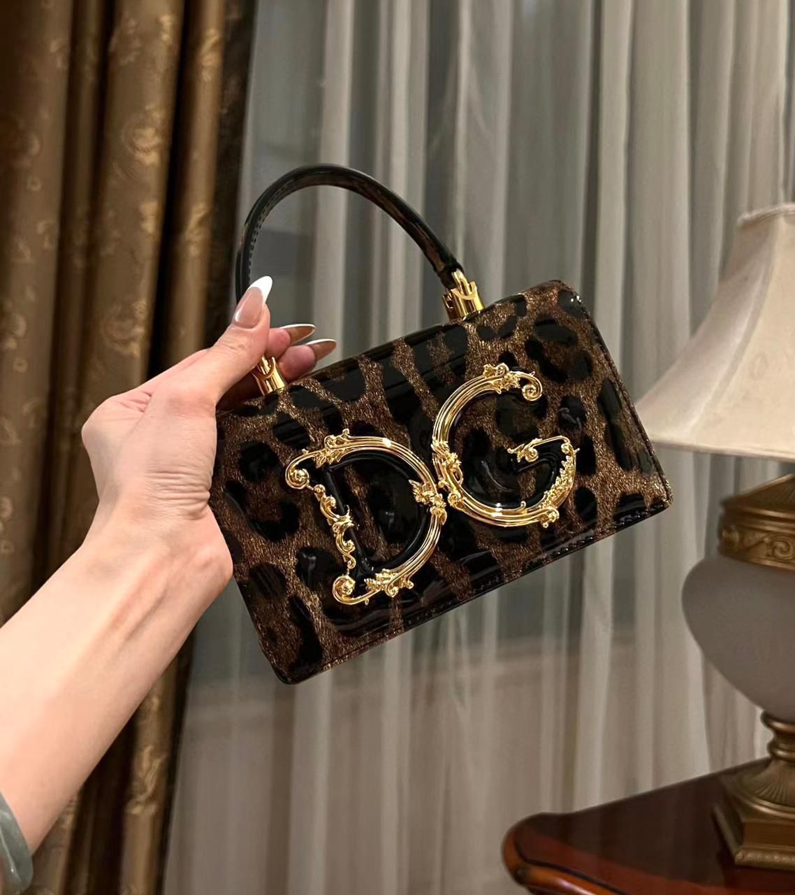 Dolce & Gabbana DG Girls mini top-handle bag in leopard-print patent calf leather. image 1