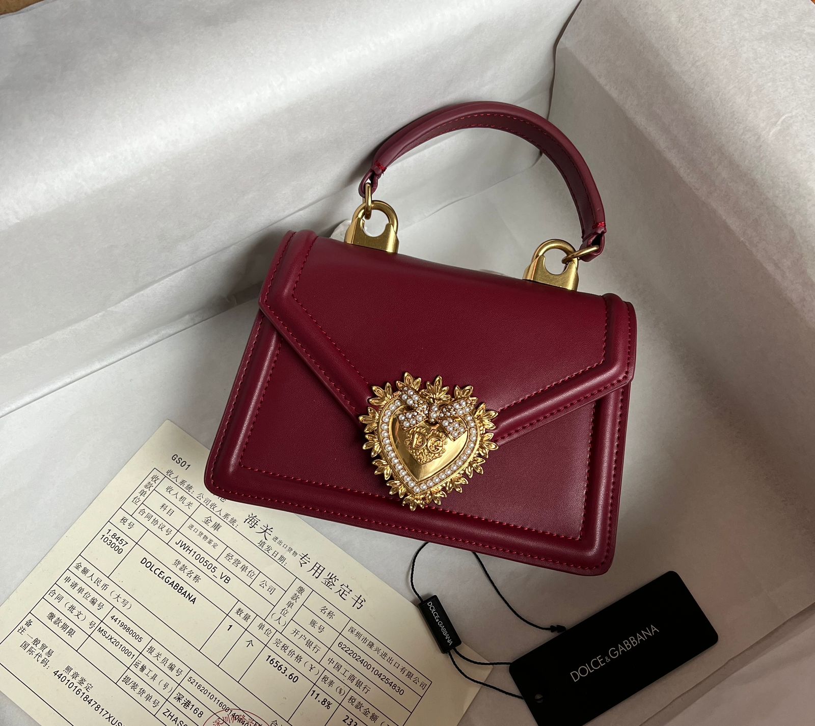 Dolce & Gabbana Devotion top-handle bag in red calfskin leather with a bejeweled heart closure. image 1
