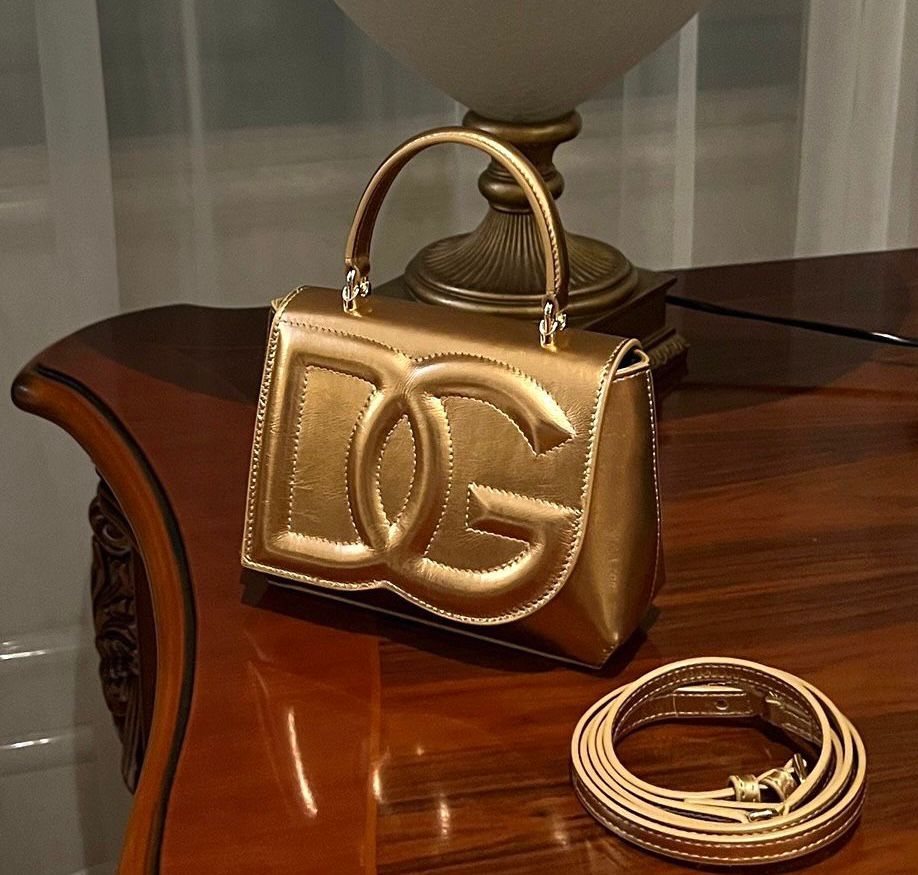 Dolce & Gabbana DG embossed metallic-effect bag in gold-tone calf leather. image 1