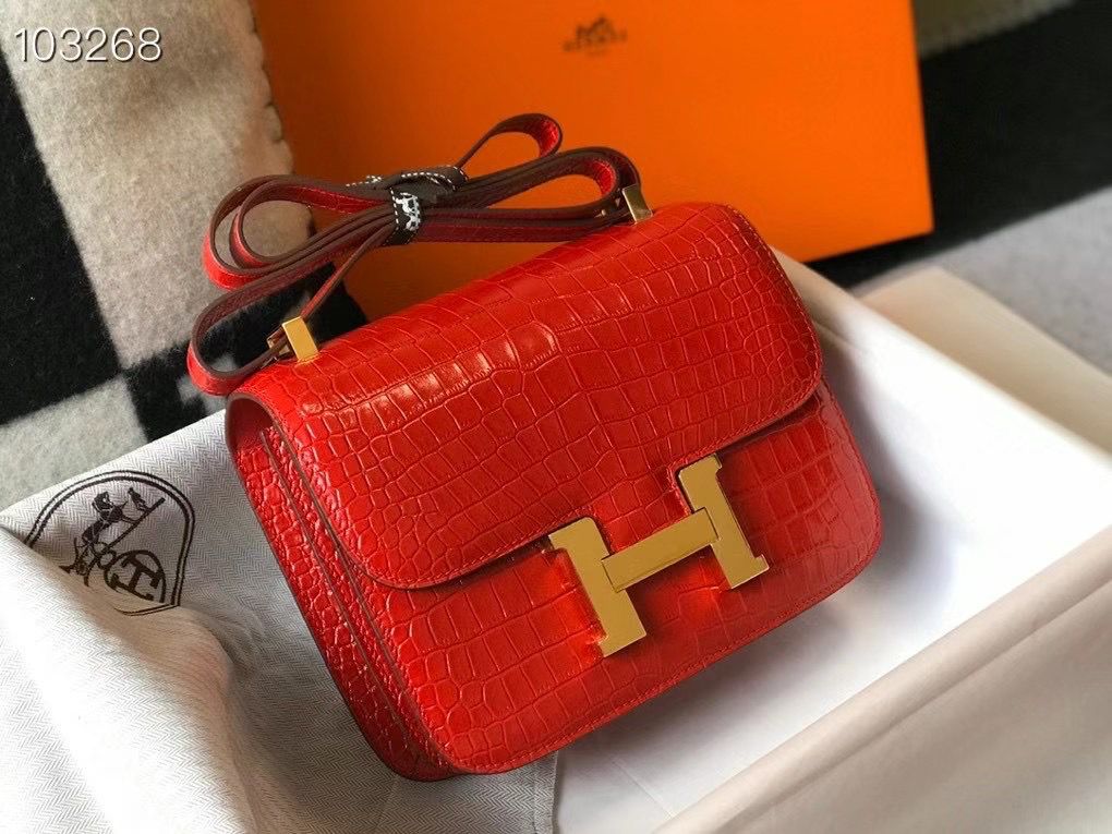 Herm?s Constance 18 bag in a shiny red alligator or crocodile leather with gold-plated hardware. image 1