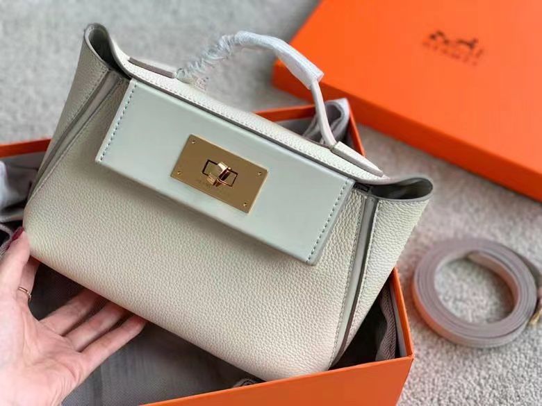 Herm?s 24/24 mini bag in a beige or off-white leather, possibly Togo leather. image 1