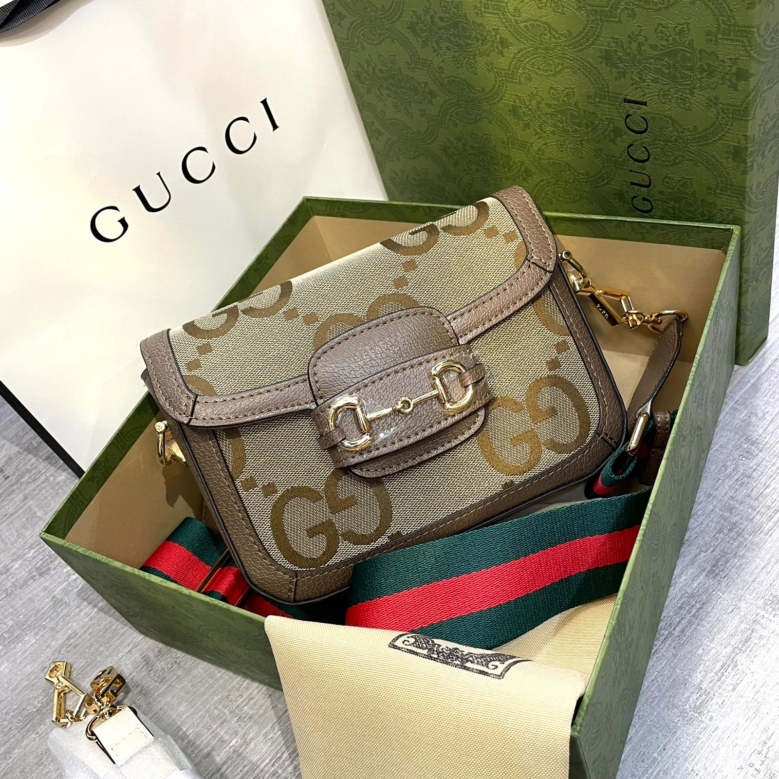 Gucci Horsebit 1955 mini bag in beige and dark brown GG Supreme canvas with brown leather trim and gold-toned hardware. image 1