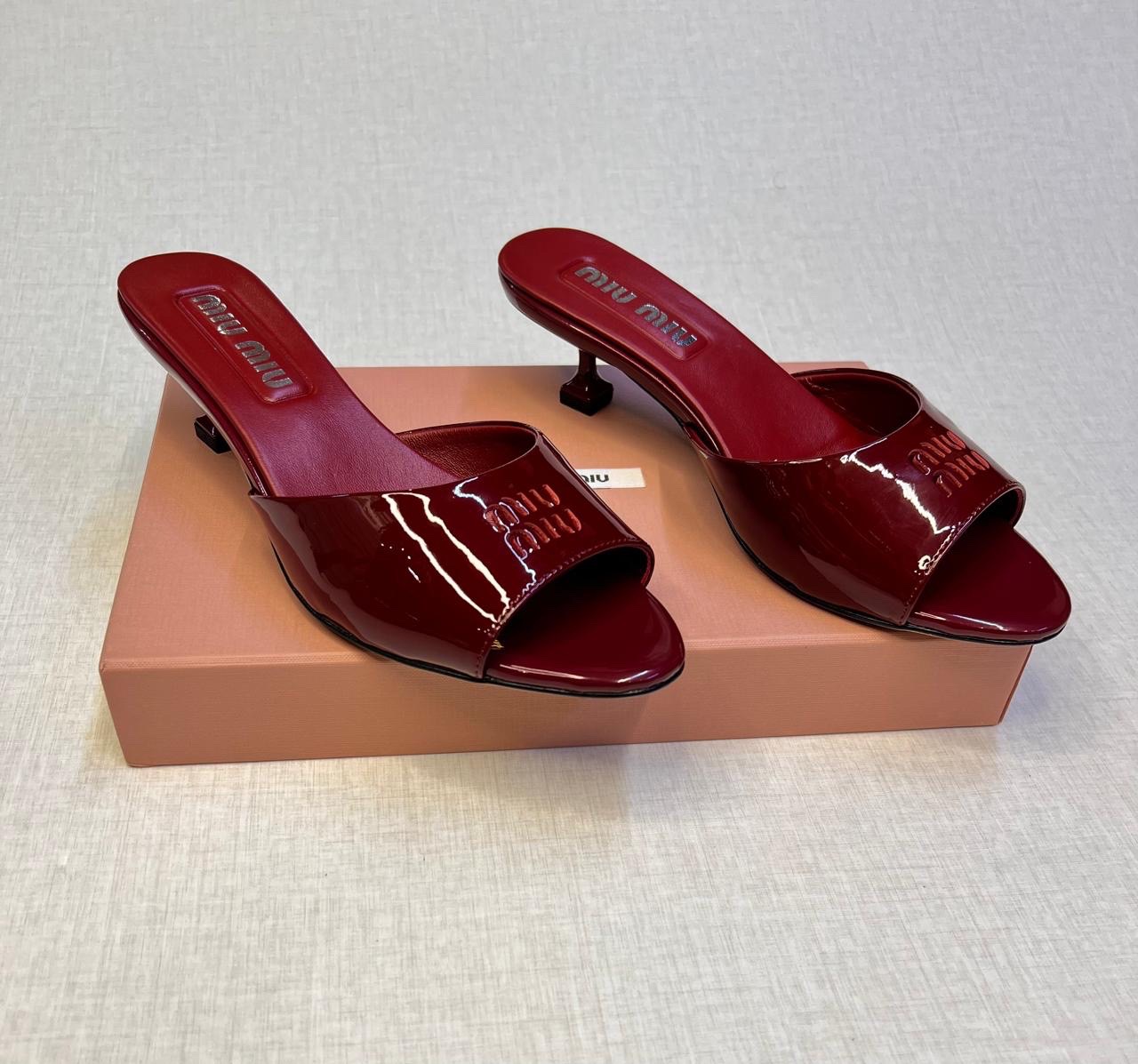 Miu Miu red patent leather mules. image 1
