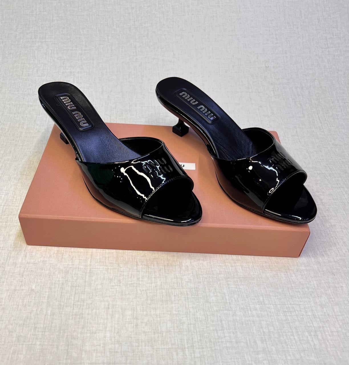 Miu Miu black patent leather mules. image 2