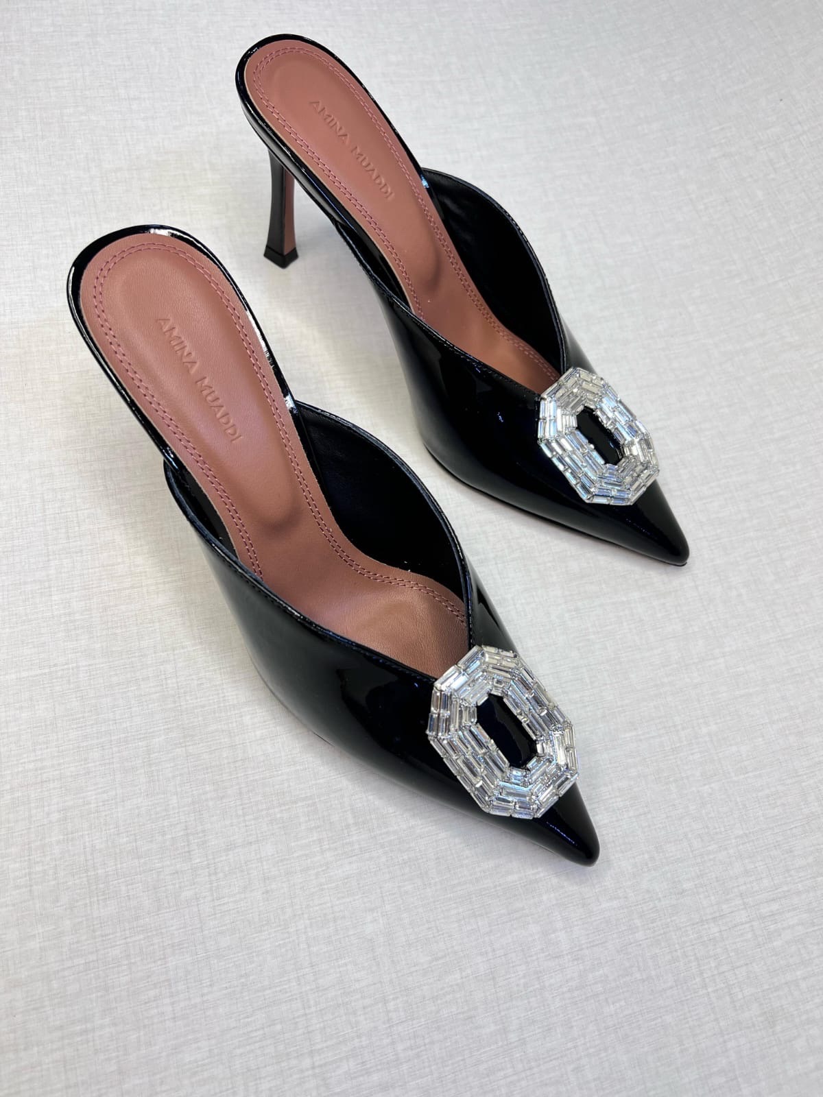 Amina Muaddi Camelia 90 mules in black patent leather. image 1