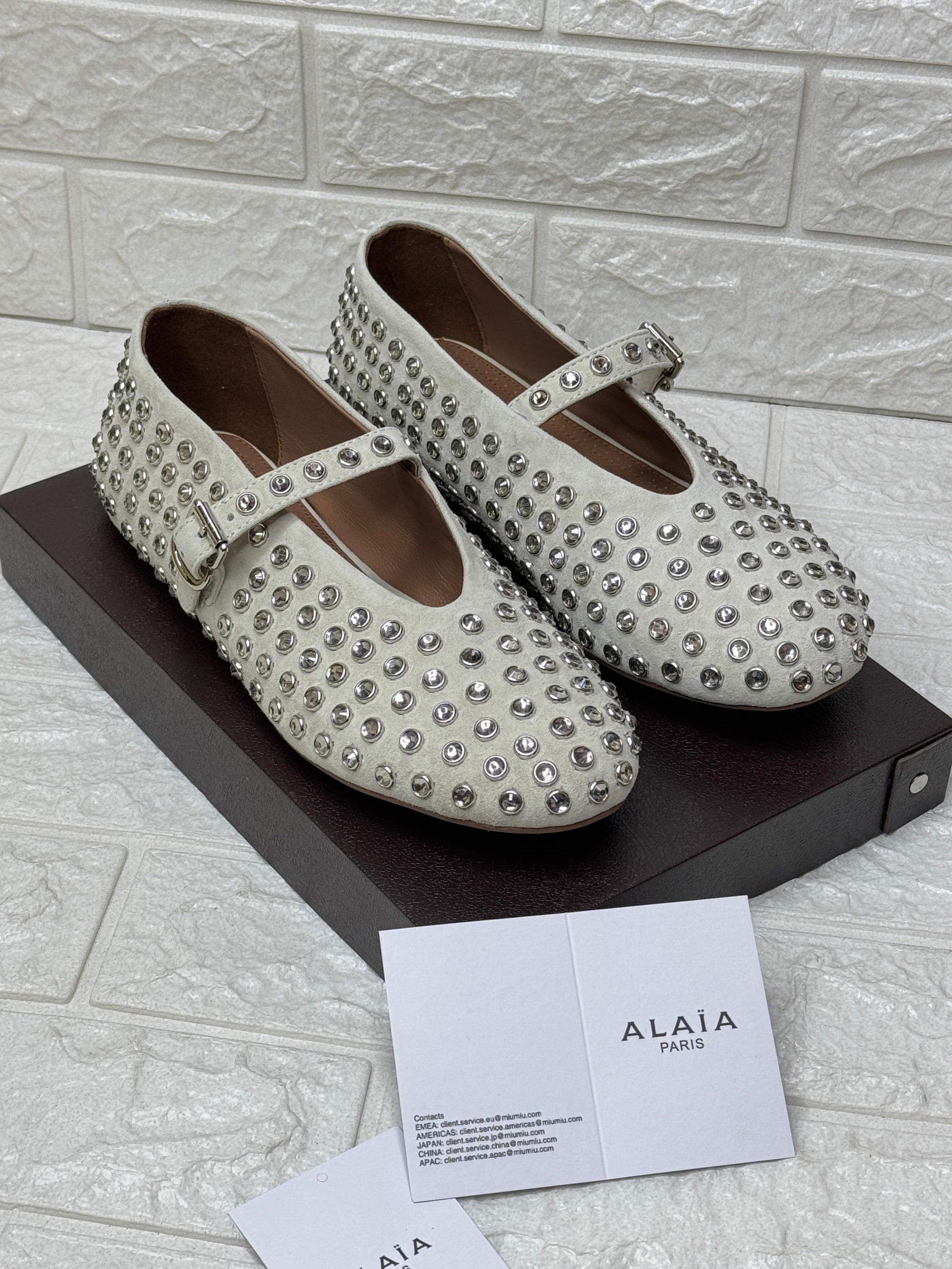 Alaïa crystal-embellished Mary-Jane ballet flats in white lambskin leather with silver-tone hardware and a rubber sole. image 1