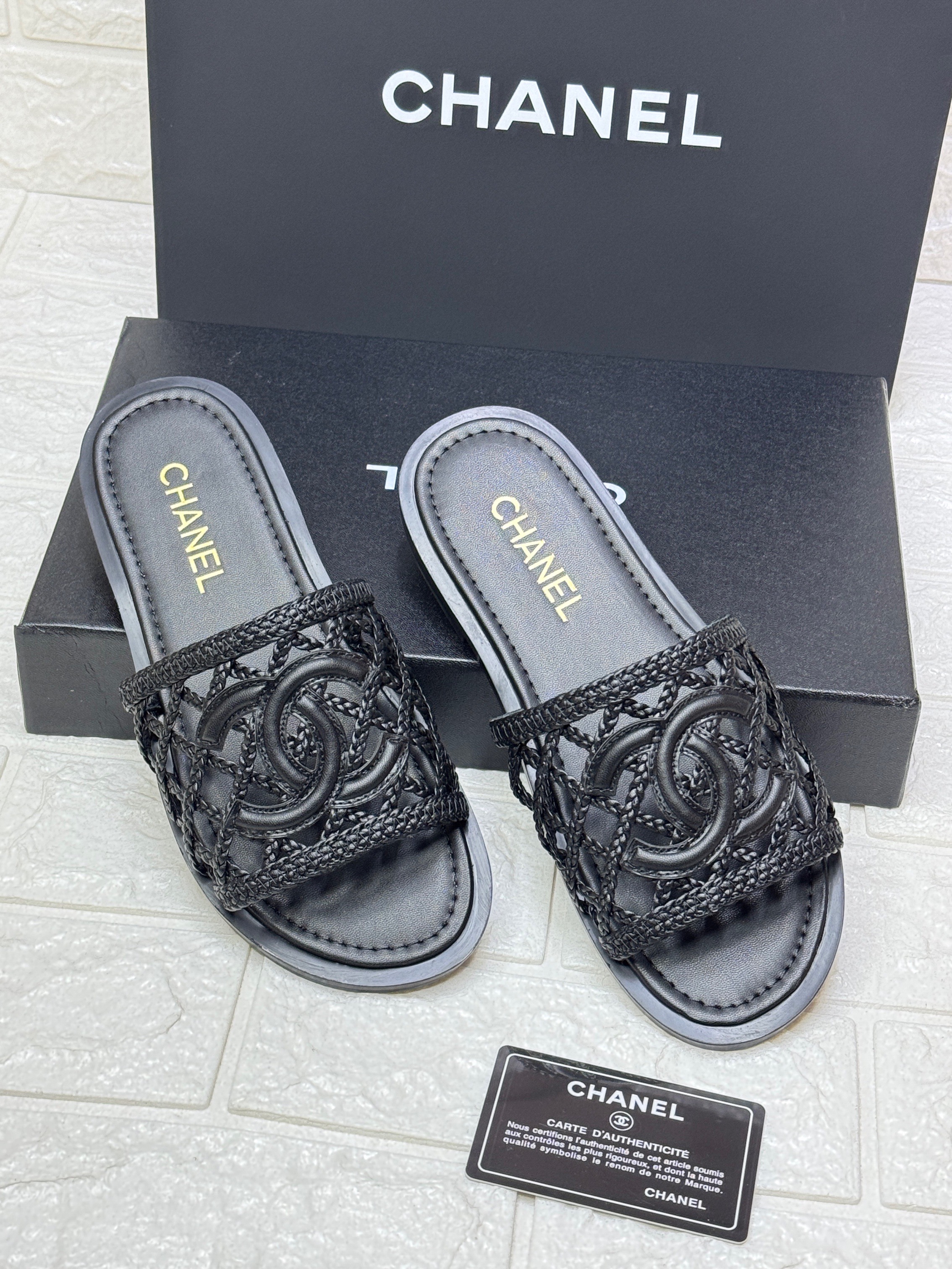 Chanel black woven leather interlocking CC logo slides. image 1
