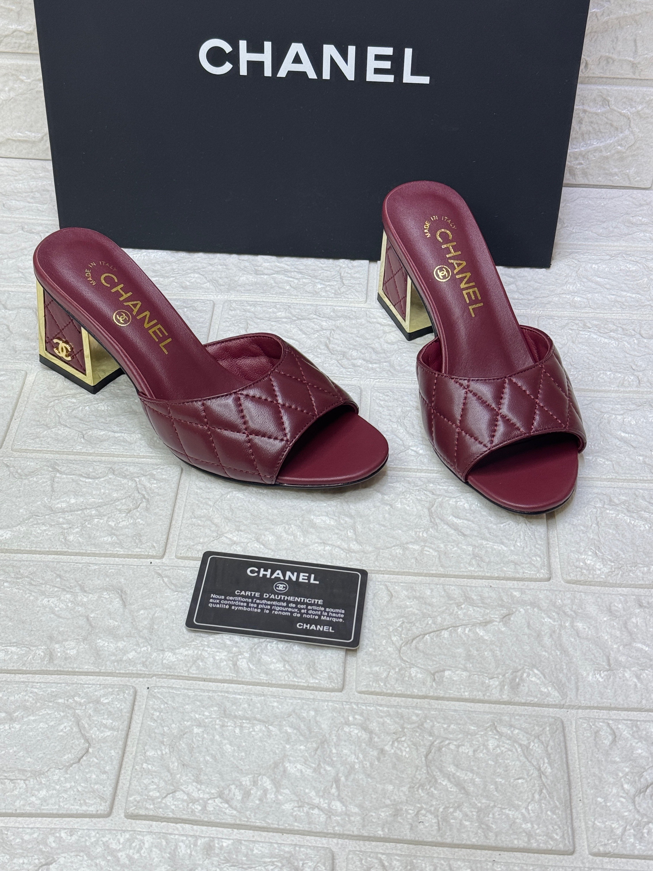 Chanel slingback mule heels in a burgundy or maroon quilted leather with a gold-tone heel. image 1