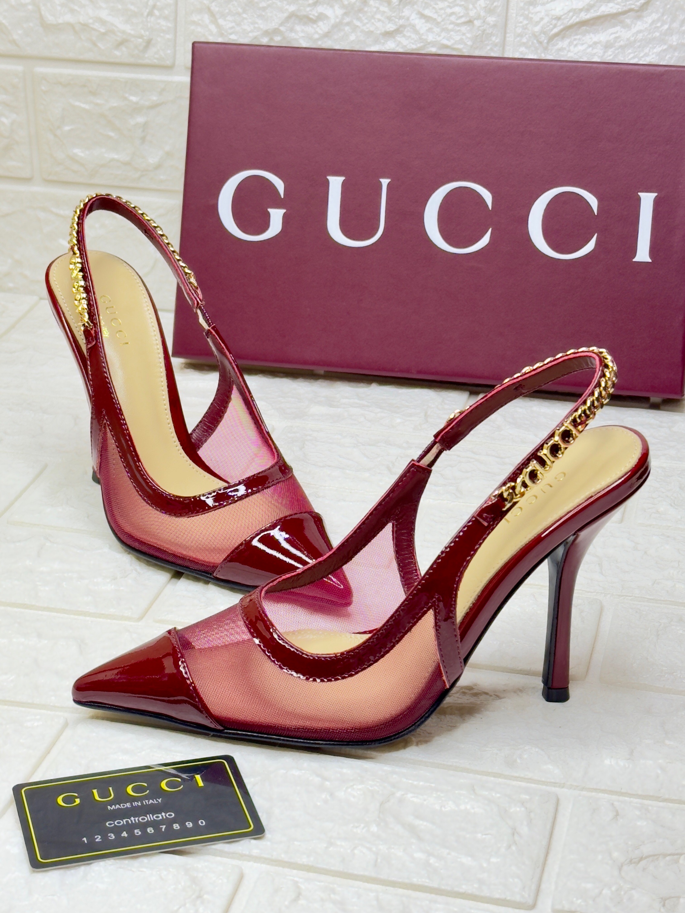 Gucci Signoria slingback pump in burgundy patent leather and mesh with a gold-tone chain detail. image 1