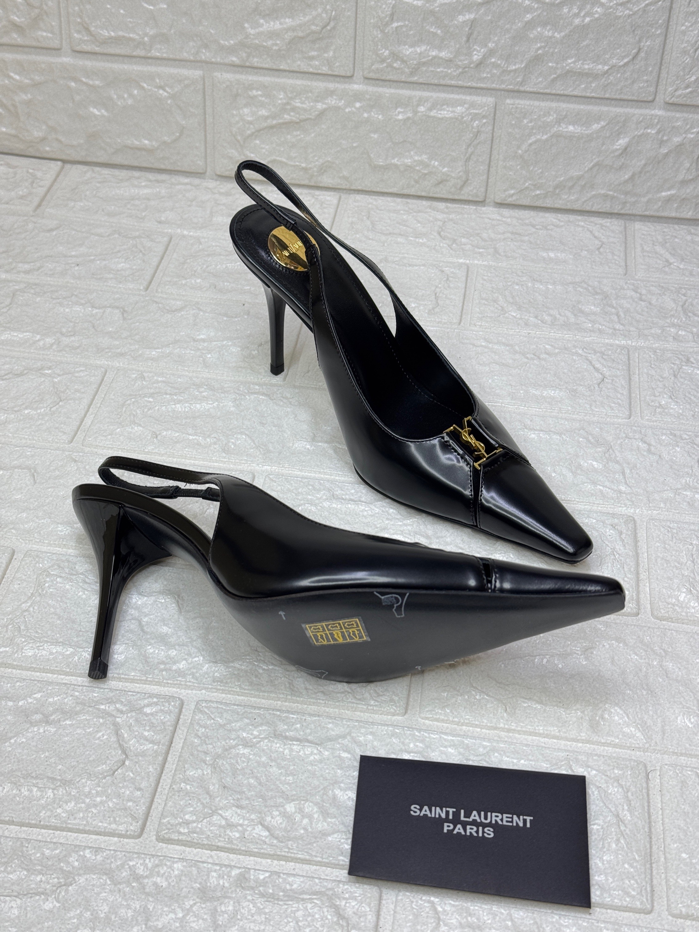 Saint Laurent Babylone Breteuil slingback pump in black patent leather with a gold-tone Cassandre logo accent and a 90mm (3.5-inch) heel. image 1