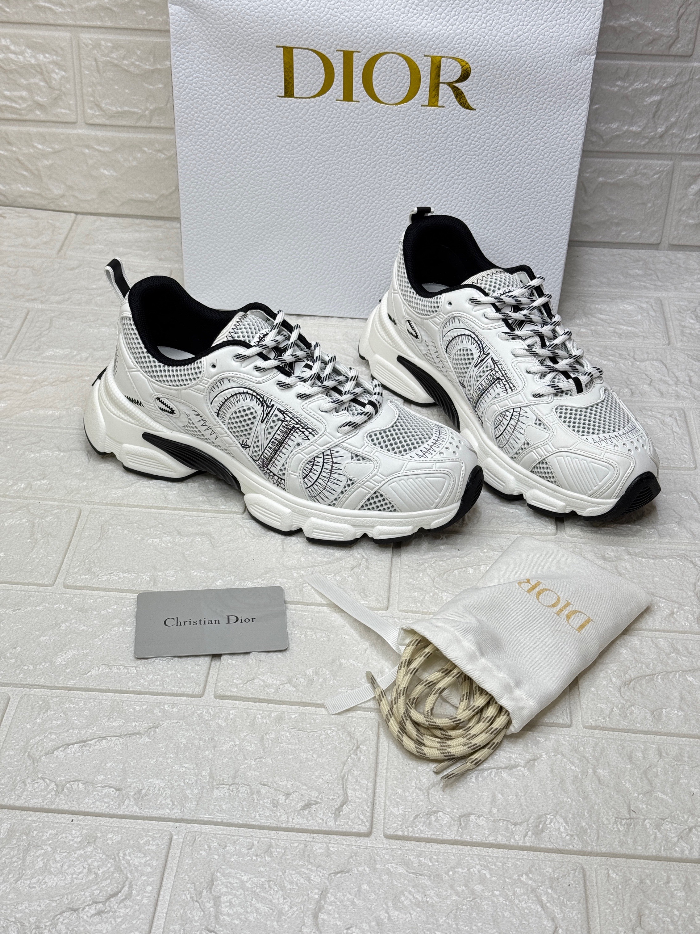 Dior Chrono sneakers in white mesh with silver-tone laminated leather-effect panels. image 1
