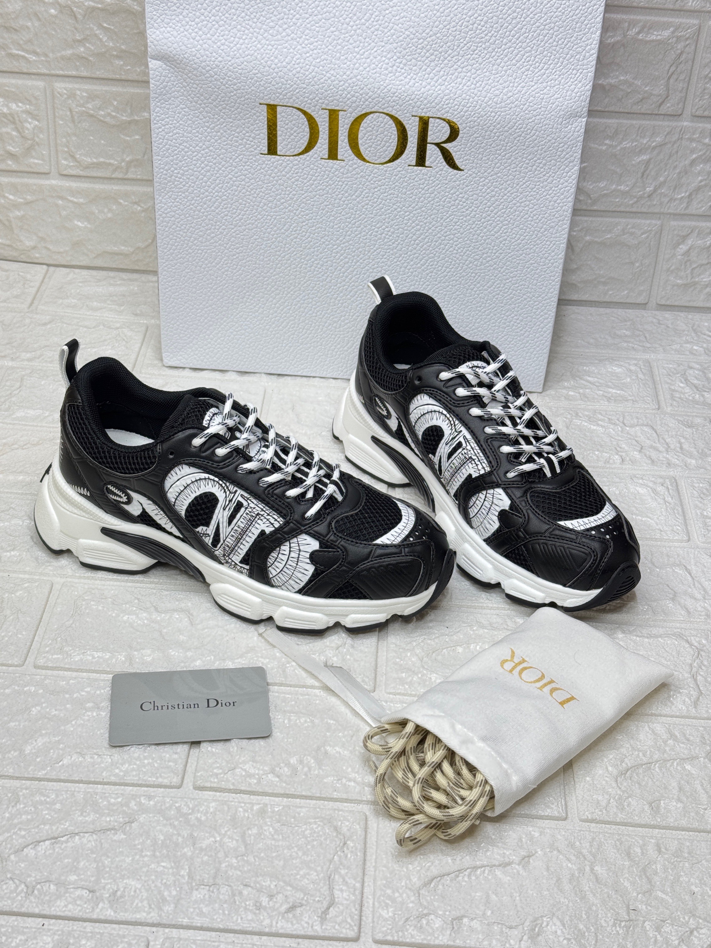 Dior Chrono sneakers in a black and white colorway. image 1