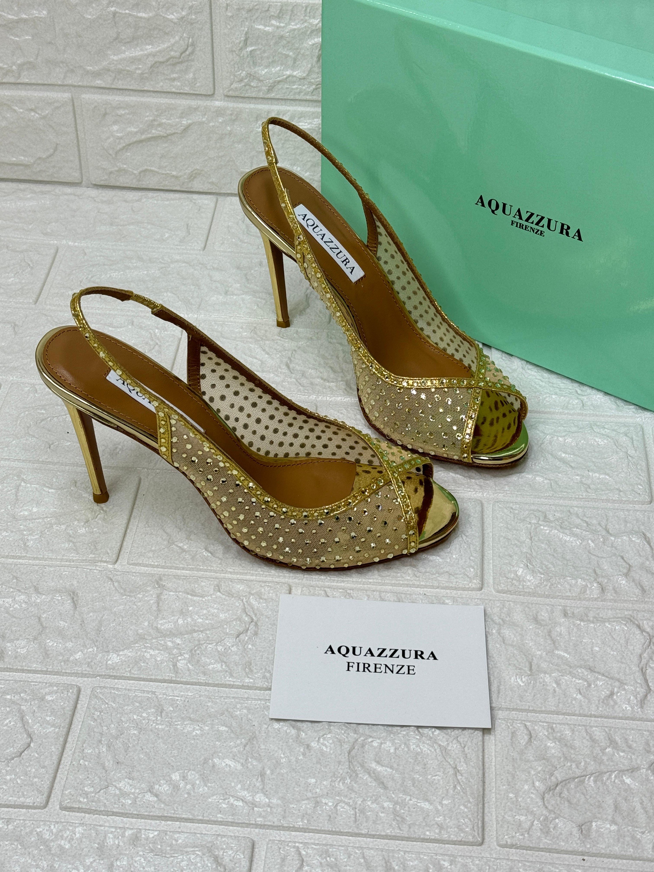 Aquazzura slingback sandals in a gold metallic finish with mesh and stud detailing image 1