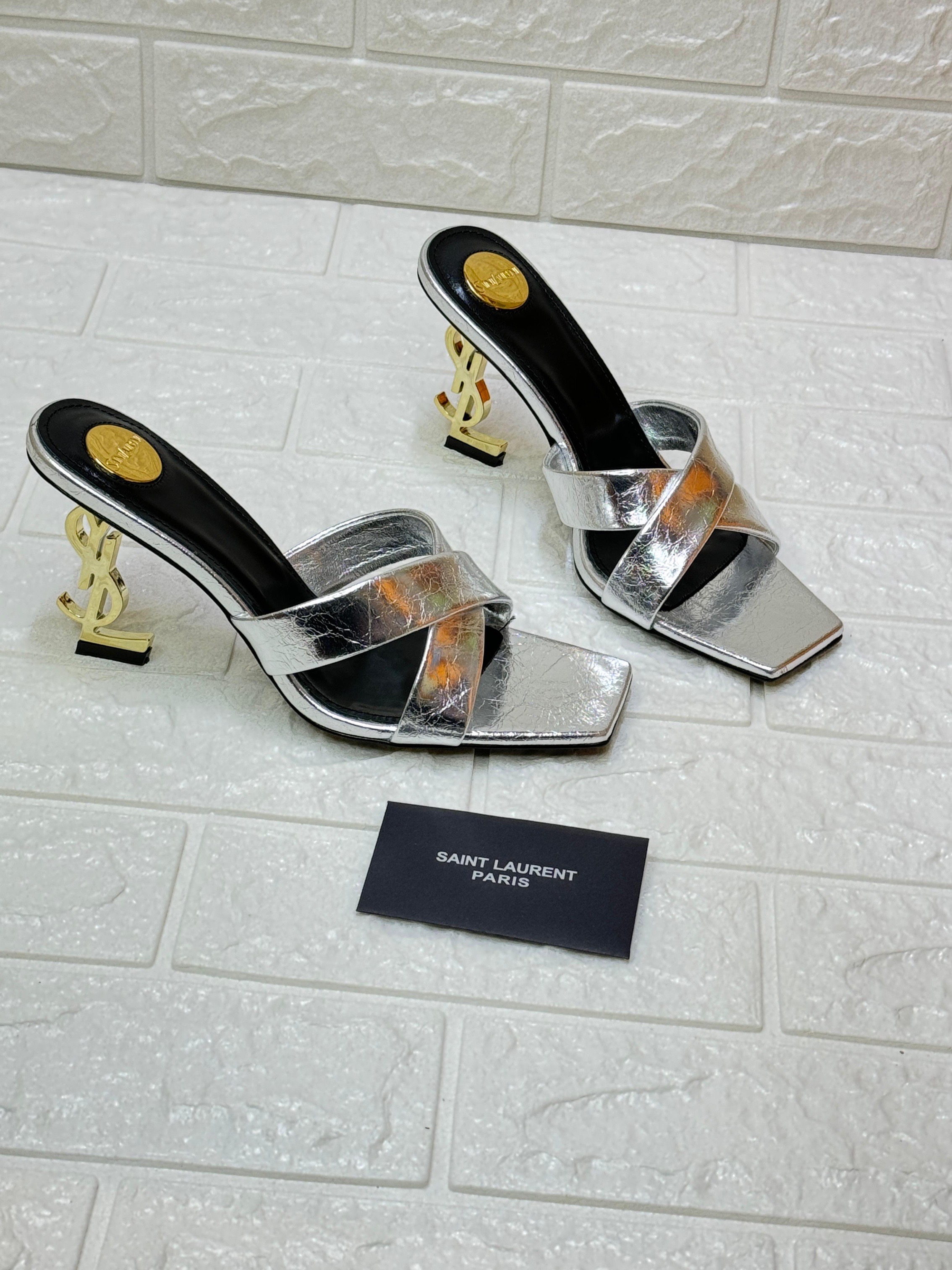 Saint Laurent Paris Opyum metallic silver leather mules with an interlocking YSL heel. image 1