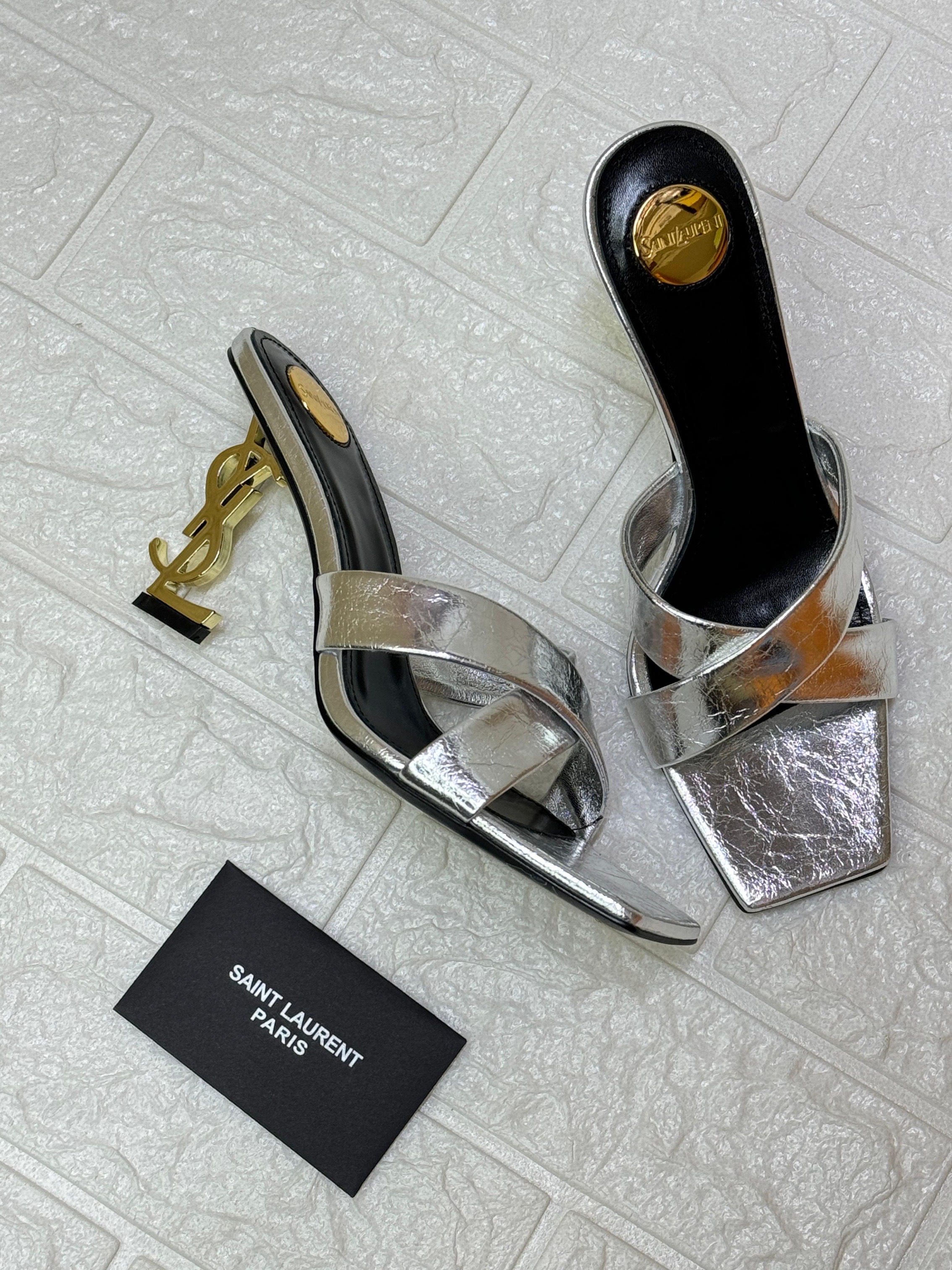 Saint Laurent Paris Opyum metallic silver leather mules with an interlocking YSL heel. image 2