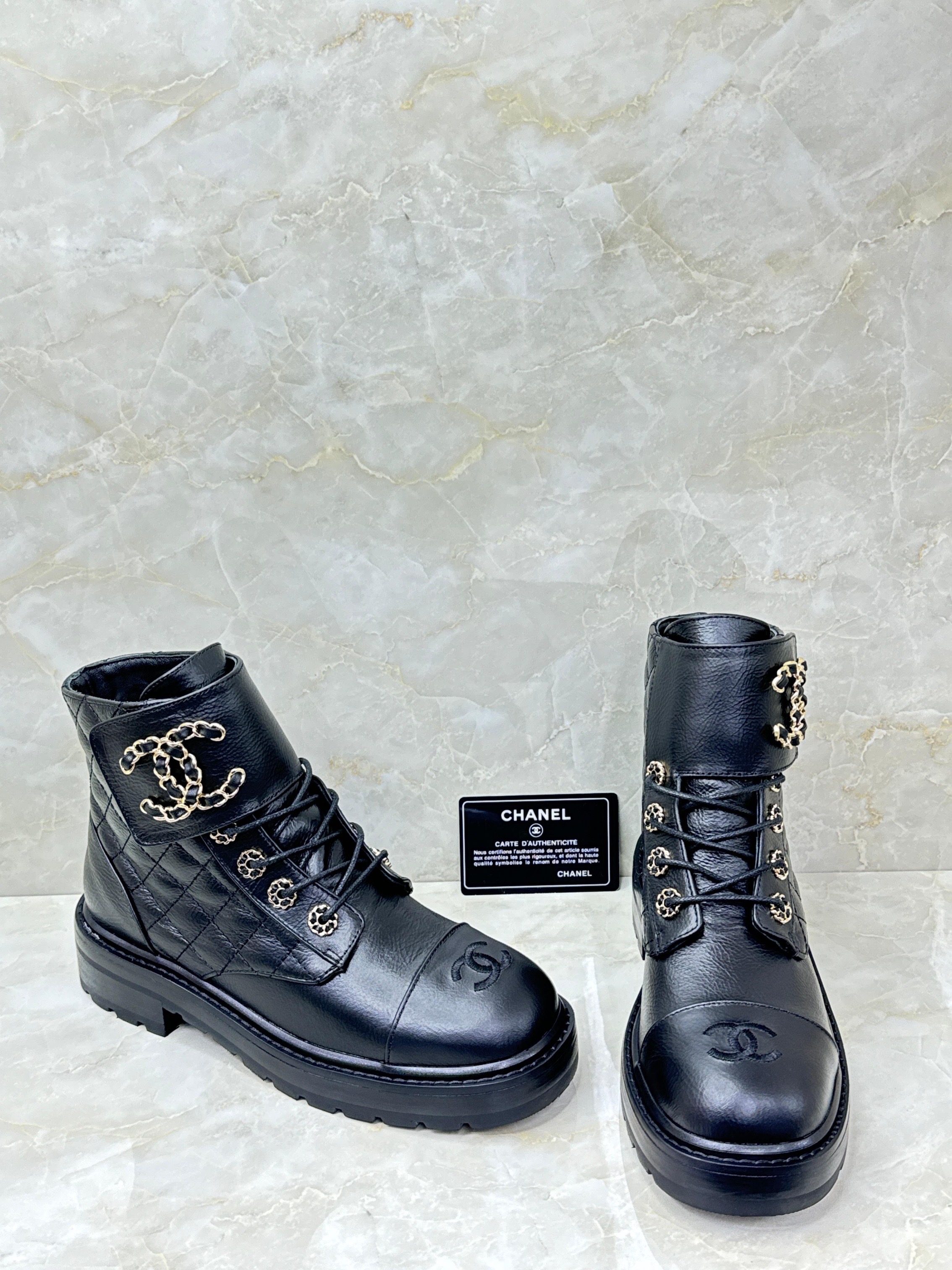 Chanel black quilted leather chain combat boots with gold-tone hardware image 1