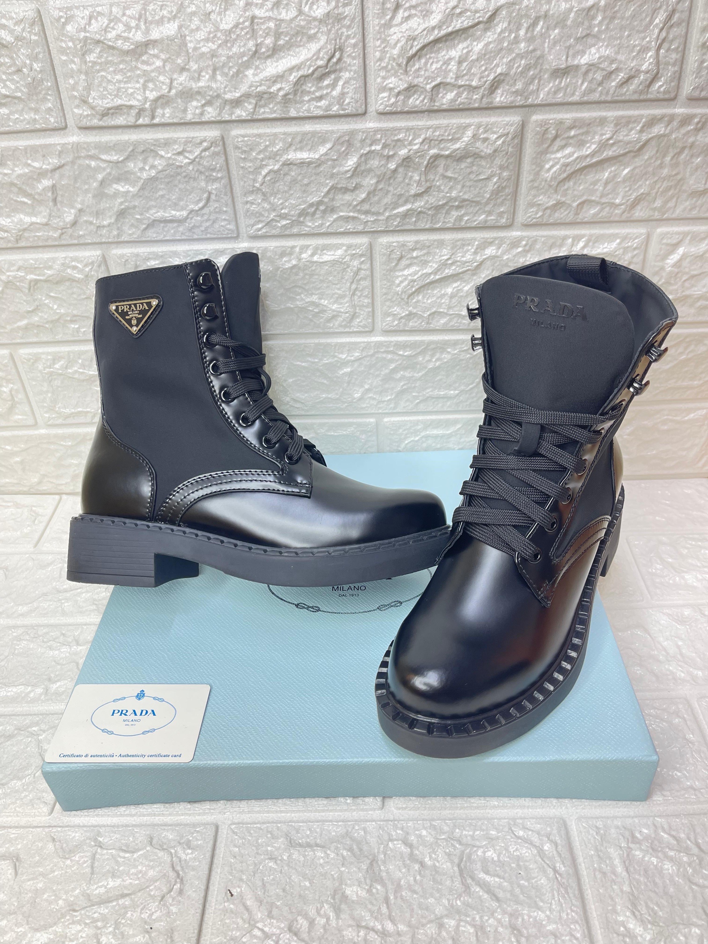Prada black leather and technical fabric combat boots. image 1