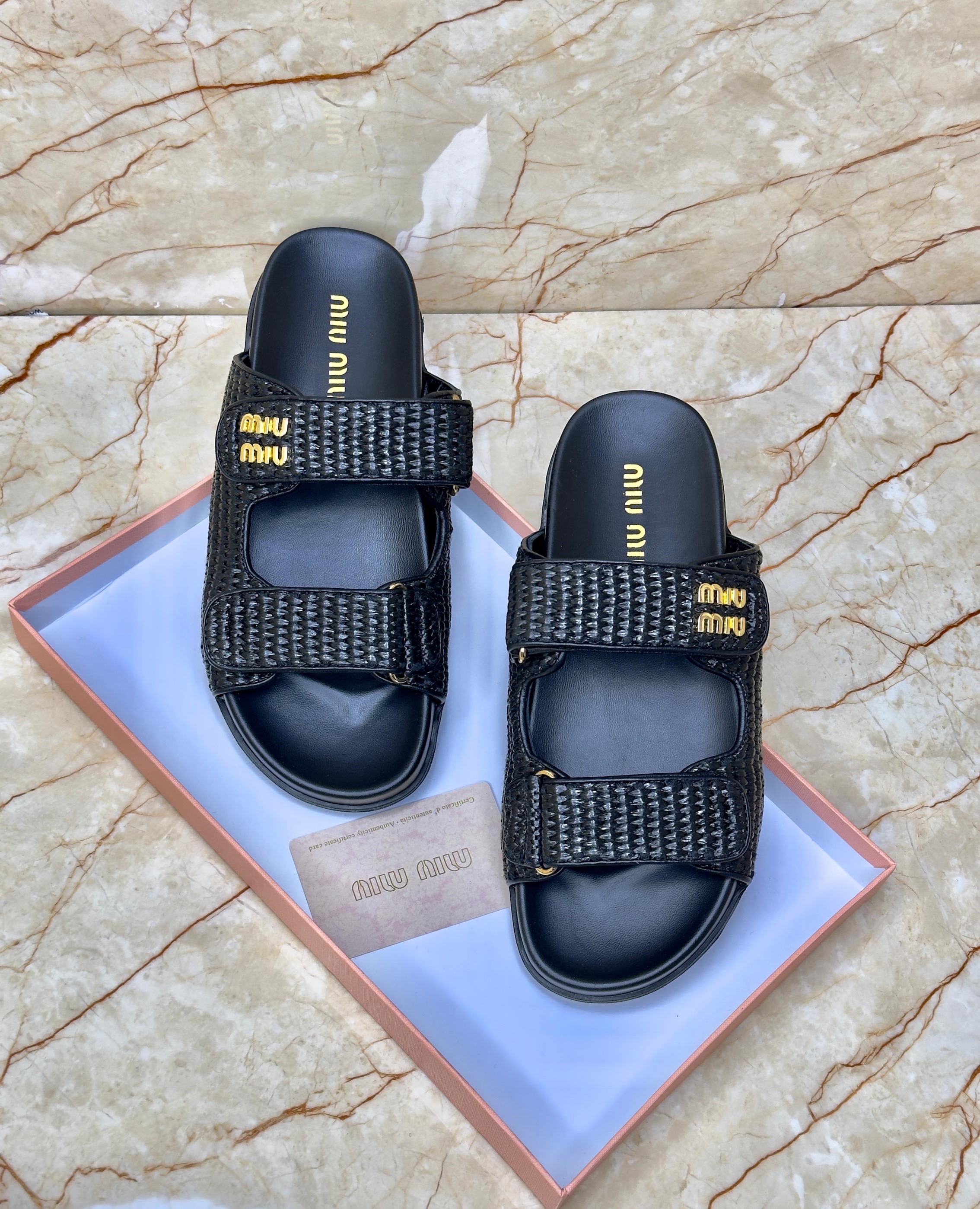 Miu Miu Sporty Matelassé Nappa Leather Sandals in black. image 1