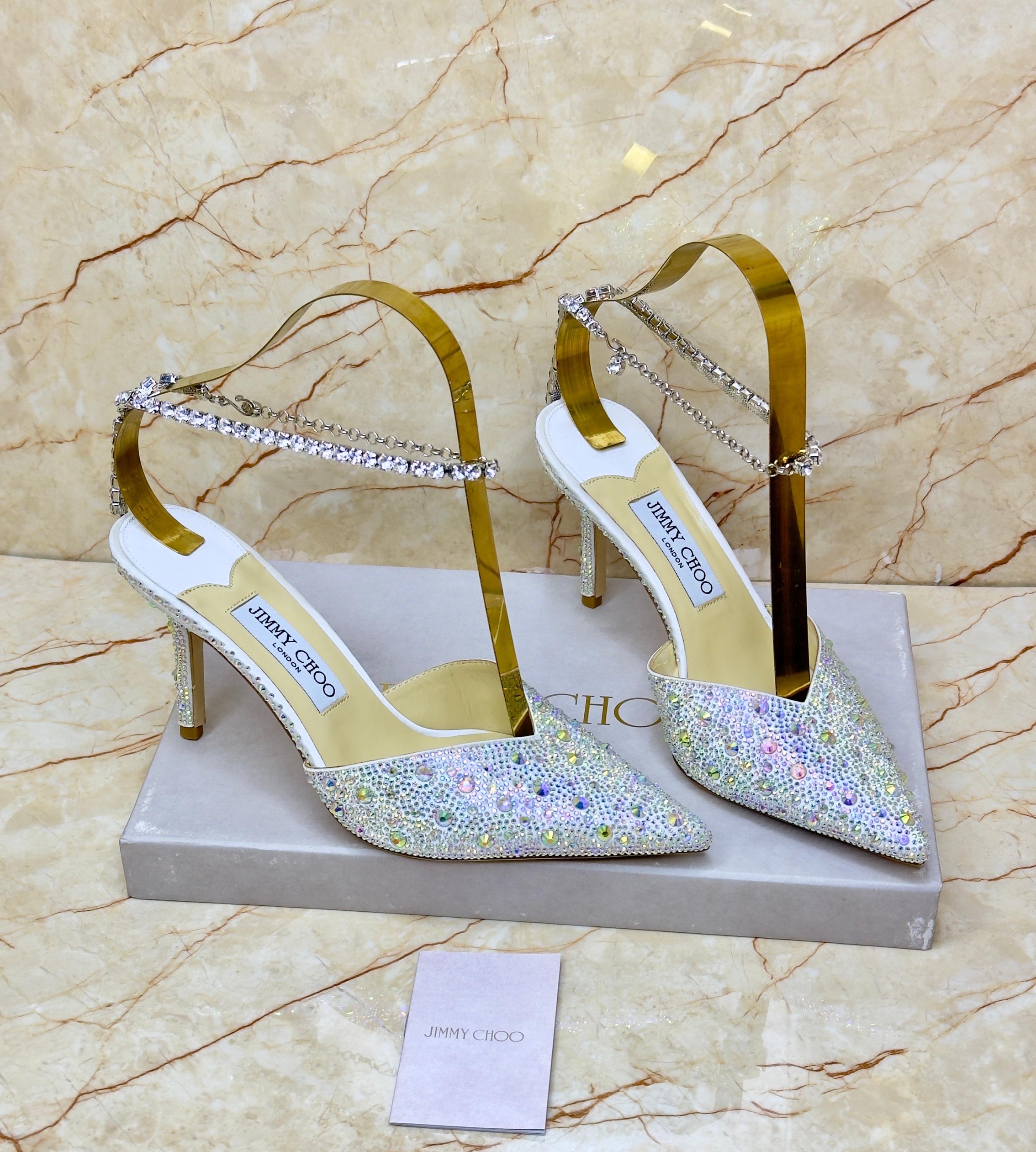 Jimmy Choo Saeda 100 crystal-embellished satin pumps in white or ivory. image 1