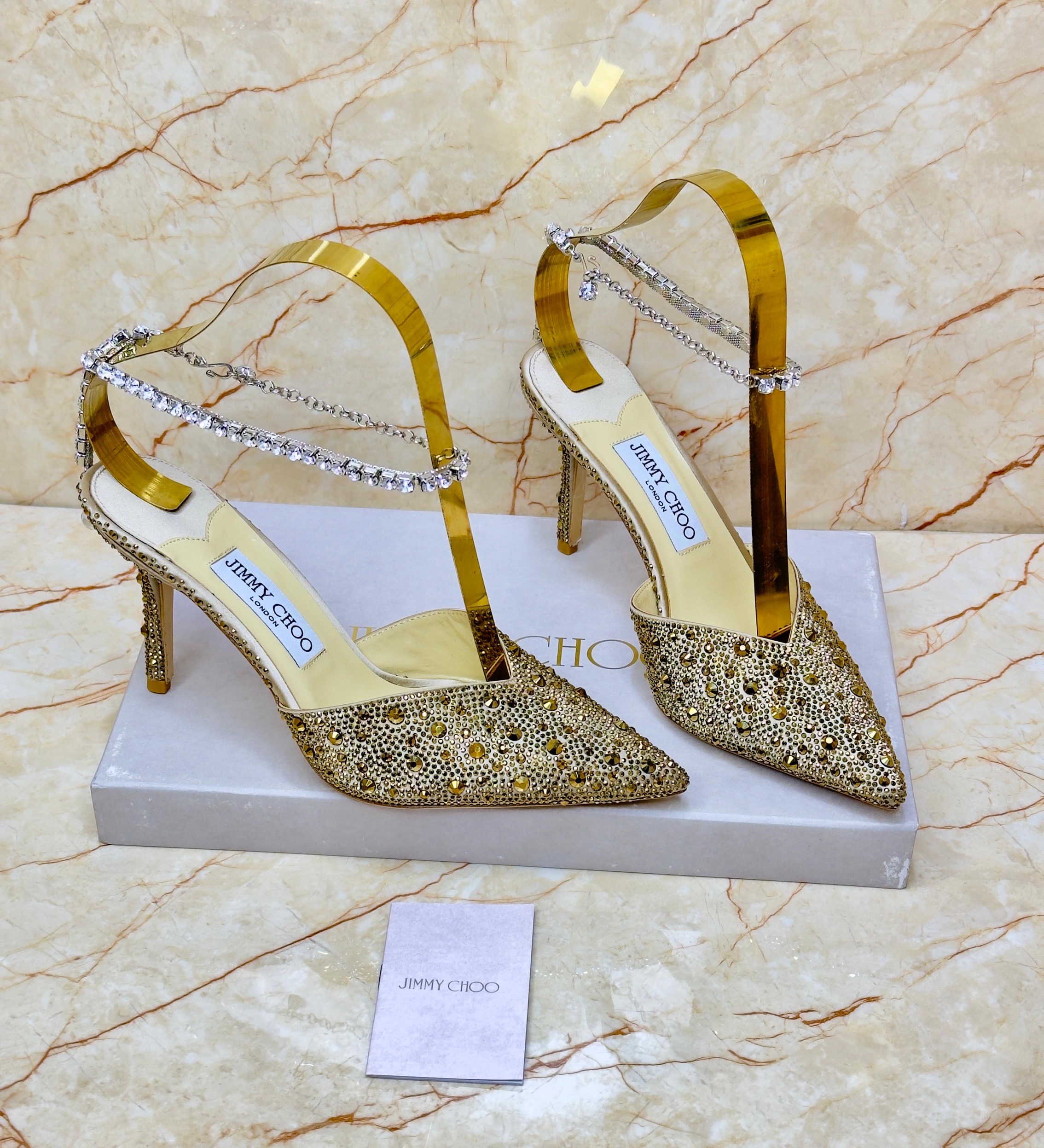Jimmy Choo Saeda 100 pumps with crystal embellishment in a gold tone. image 1