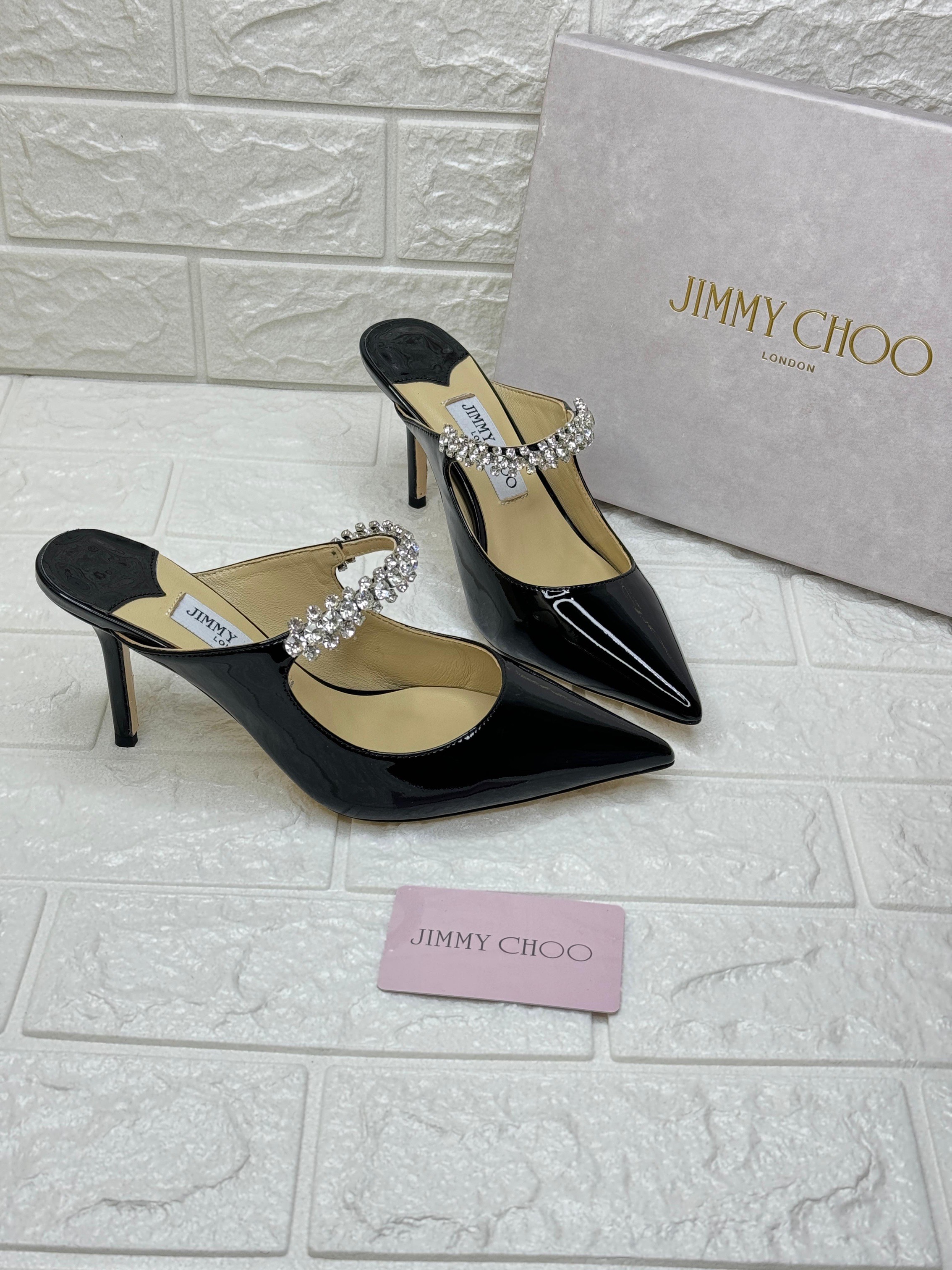 Jimmy Choo Bing mules in black patent leather with a crystal-embellished strap. image 1