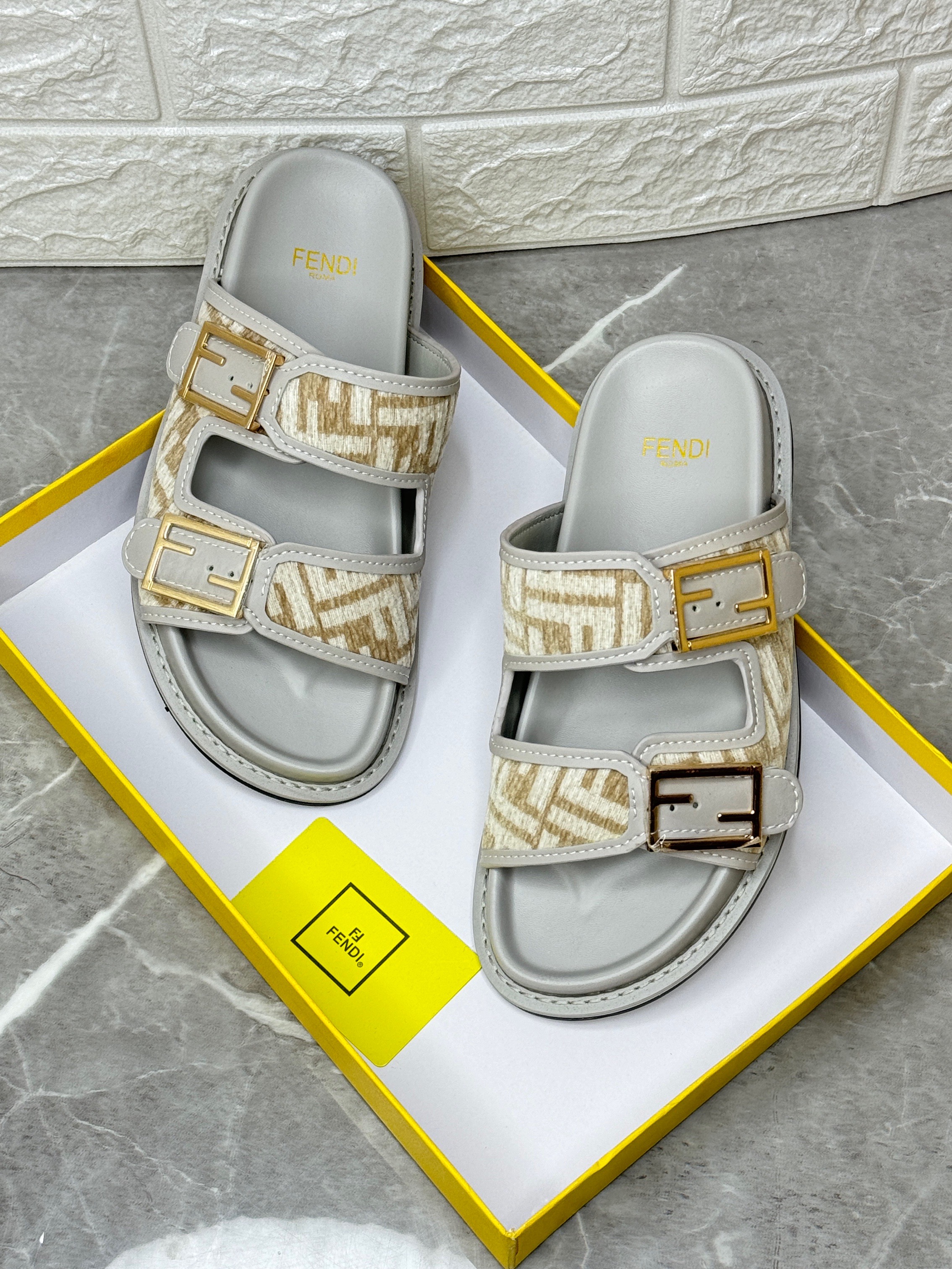 Fendi Feel double-band slides in leather with a beige jacquard FF motif. image 1