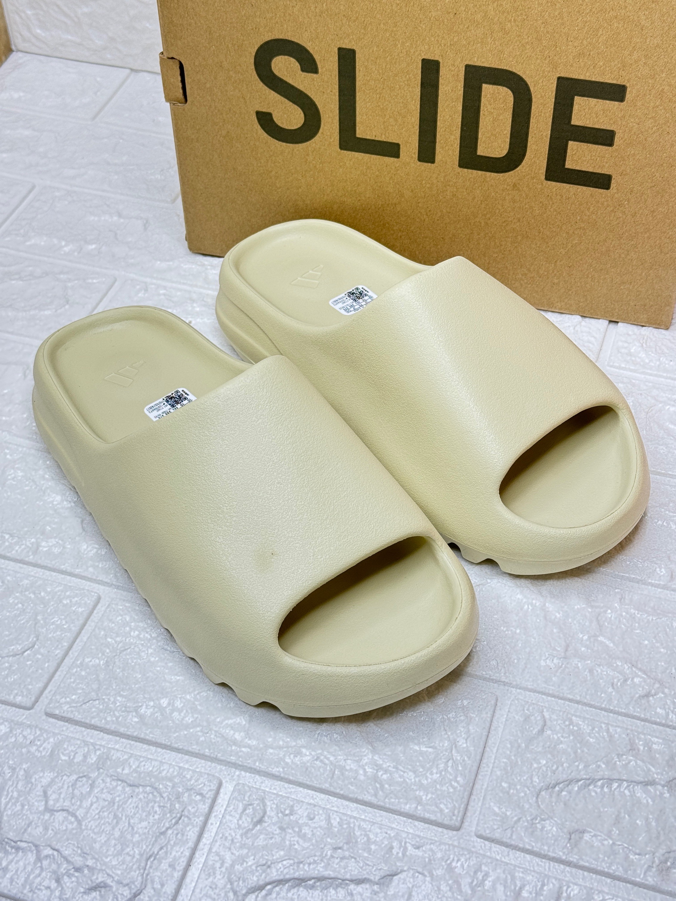 Adidas Yeezy Slide made from lightweight EVA foam. image 1