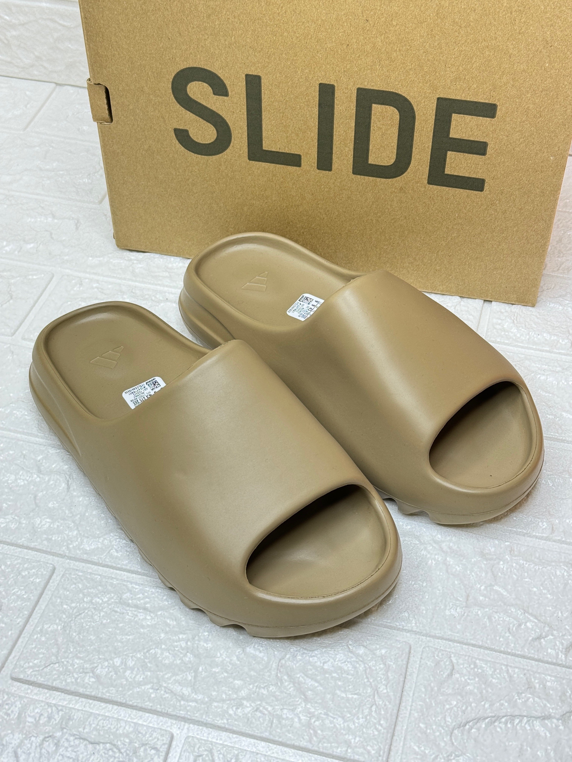 Adidas Yeezy Slide in the "Ochre" colorway. image 1