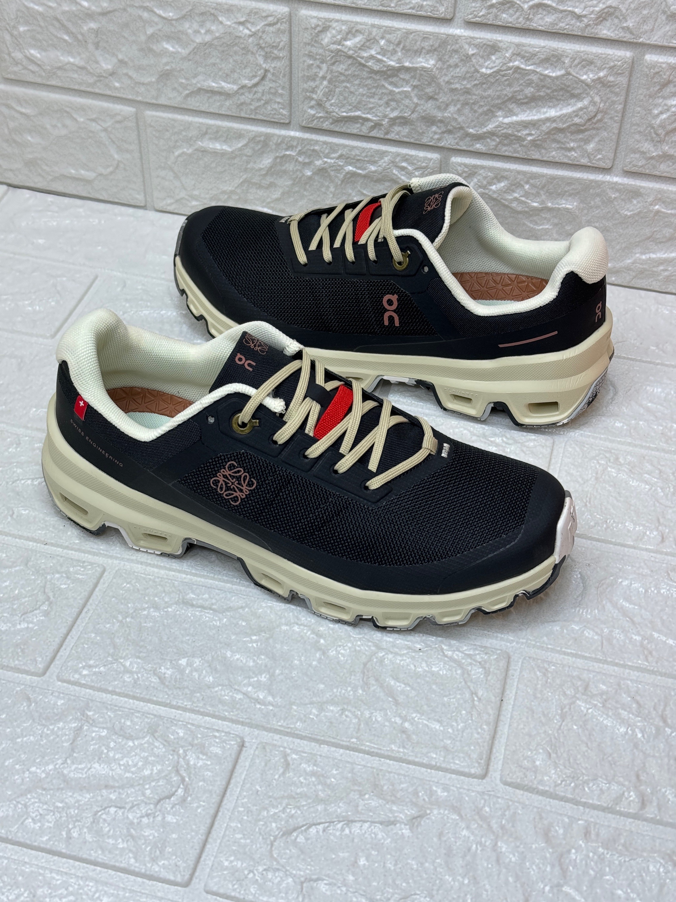 LOEWE x On Cloudventure sneakers with a cream-colored sole and light-colored laces. image 1