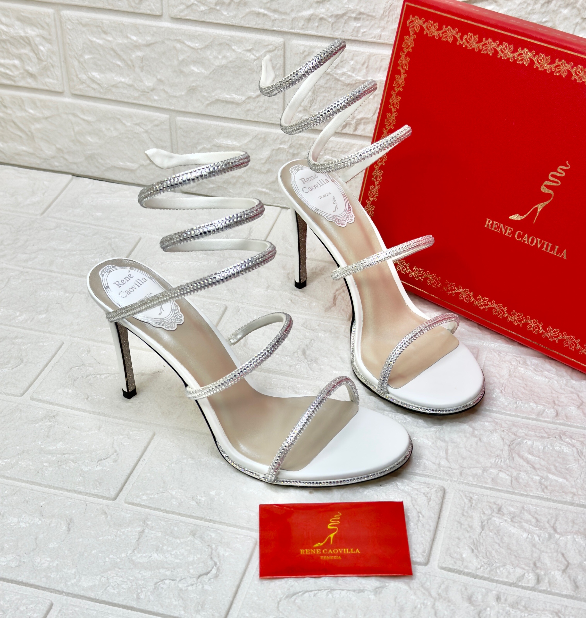Ren? Caovilla Cleo high-heel sandals in white satin with crystal embellishments and a signature coiled ankle strap. image 1