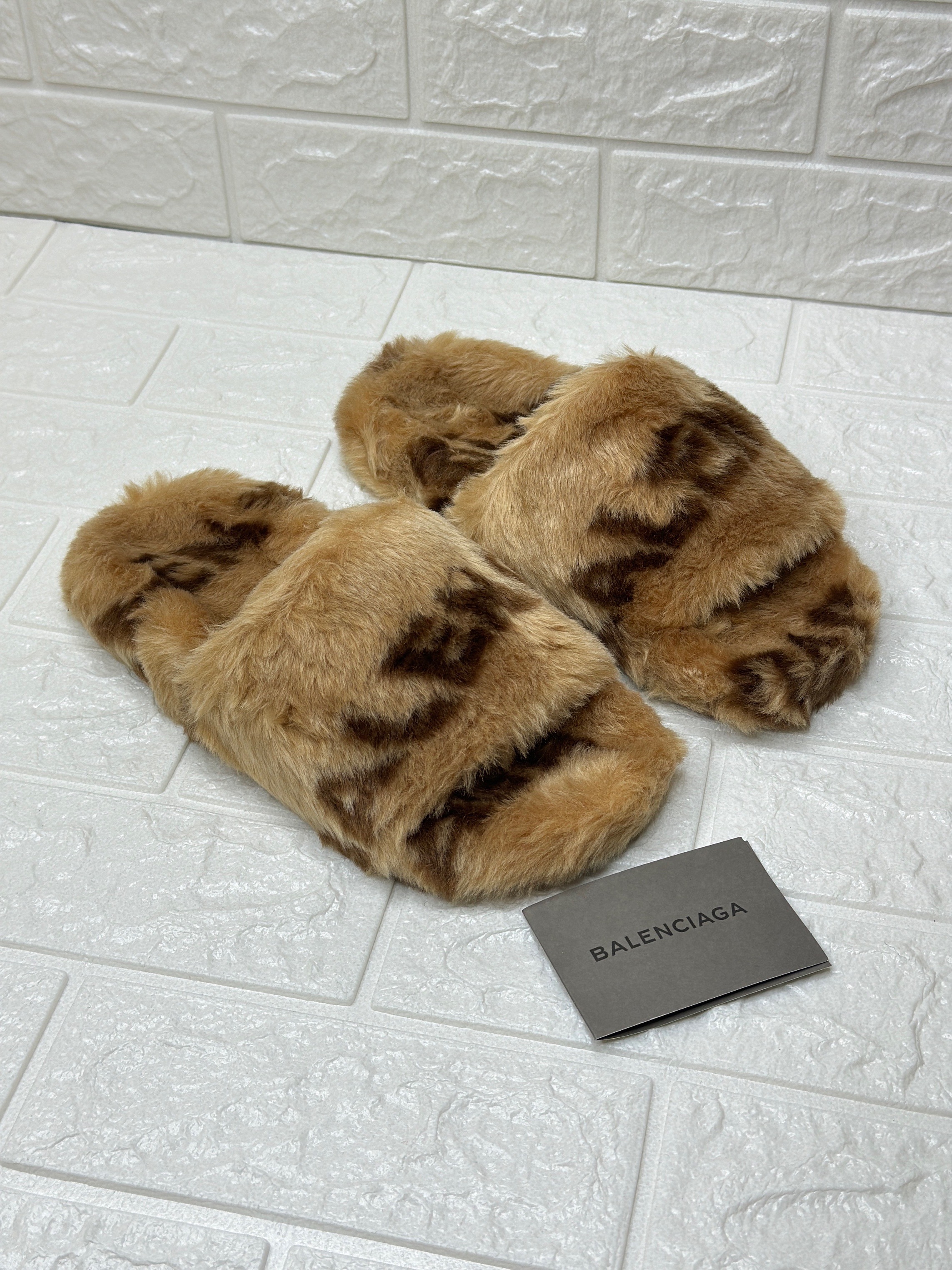 Balenciaga Furry slide sandals in a brown/white color variant. image 1