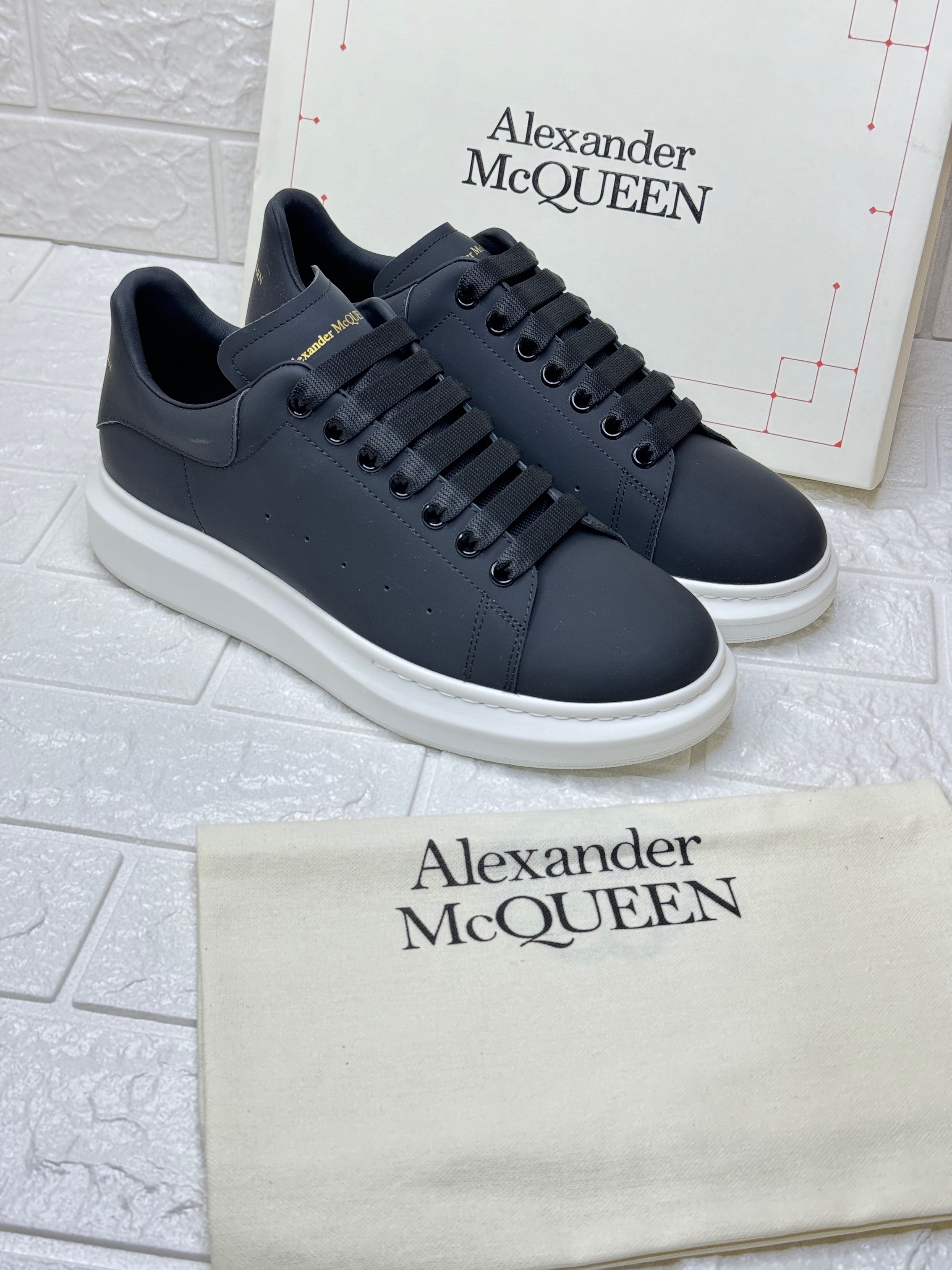 Alexander McQueen Oversized leather sneakers with a white rubber sole. image 1