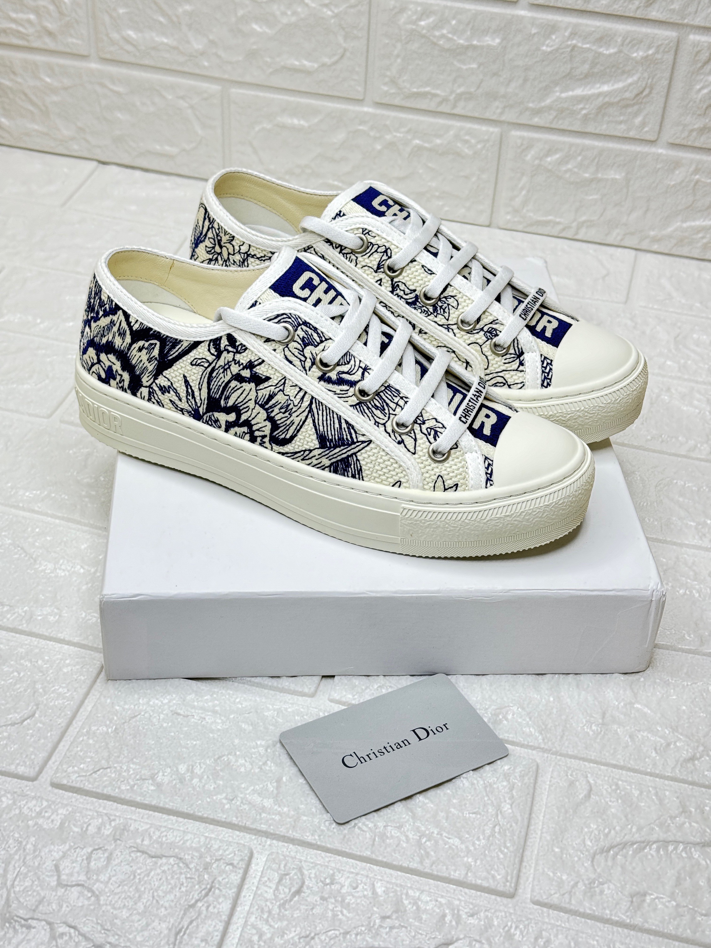 Dior Walk'n'Dior Toile de Jouy embroidered cotton low-top sneaker in navy blue and off-white. image 1