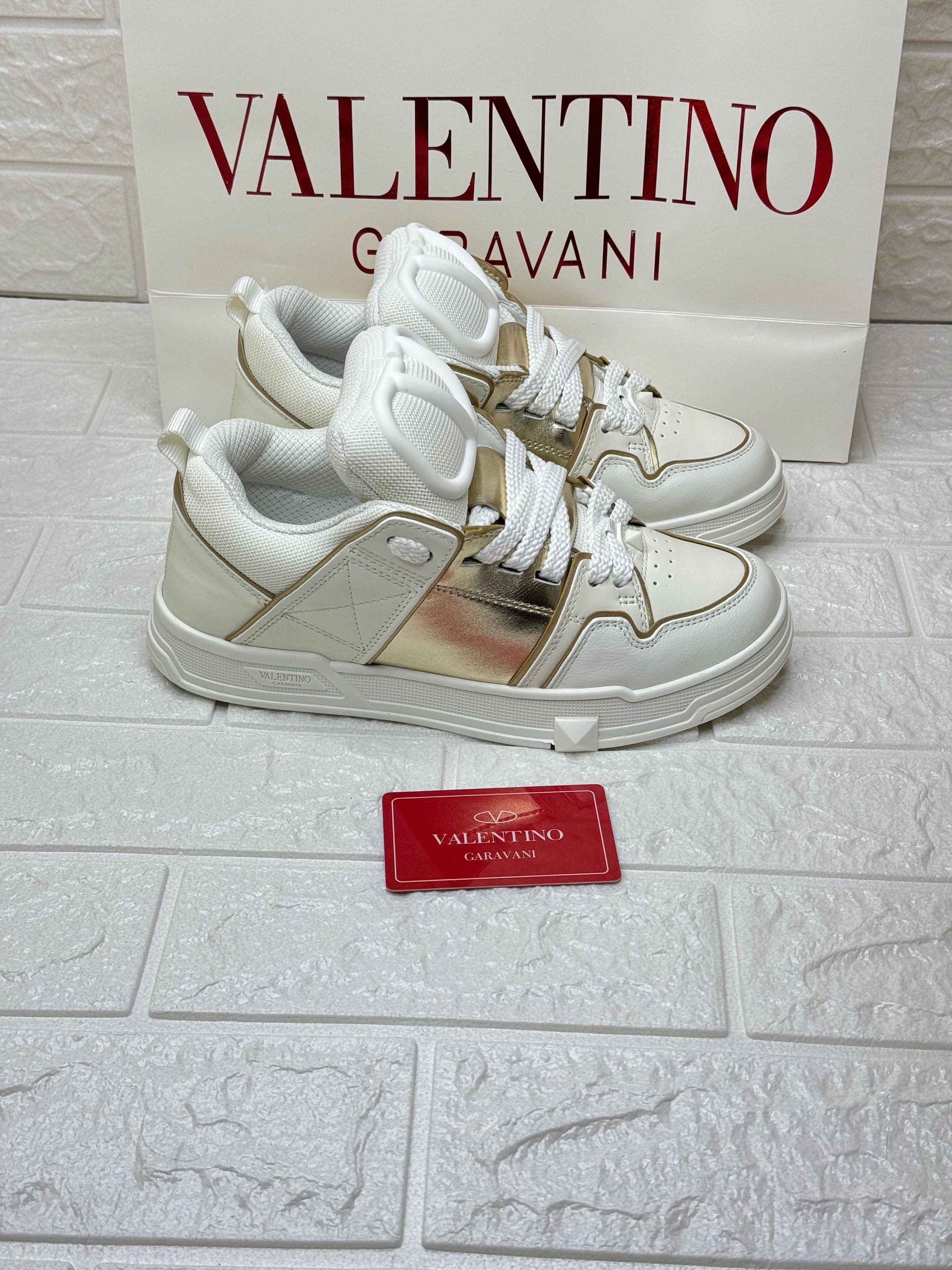 Valentino Garavani Open Skate sneakers in white calfskin with a metallic band. image 1